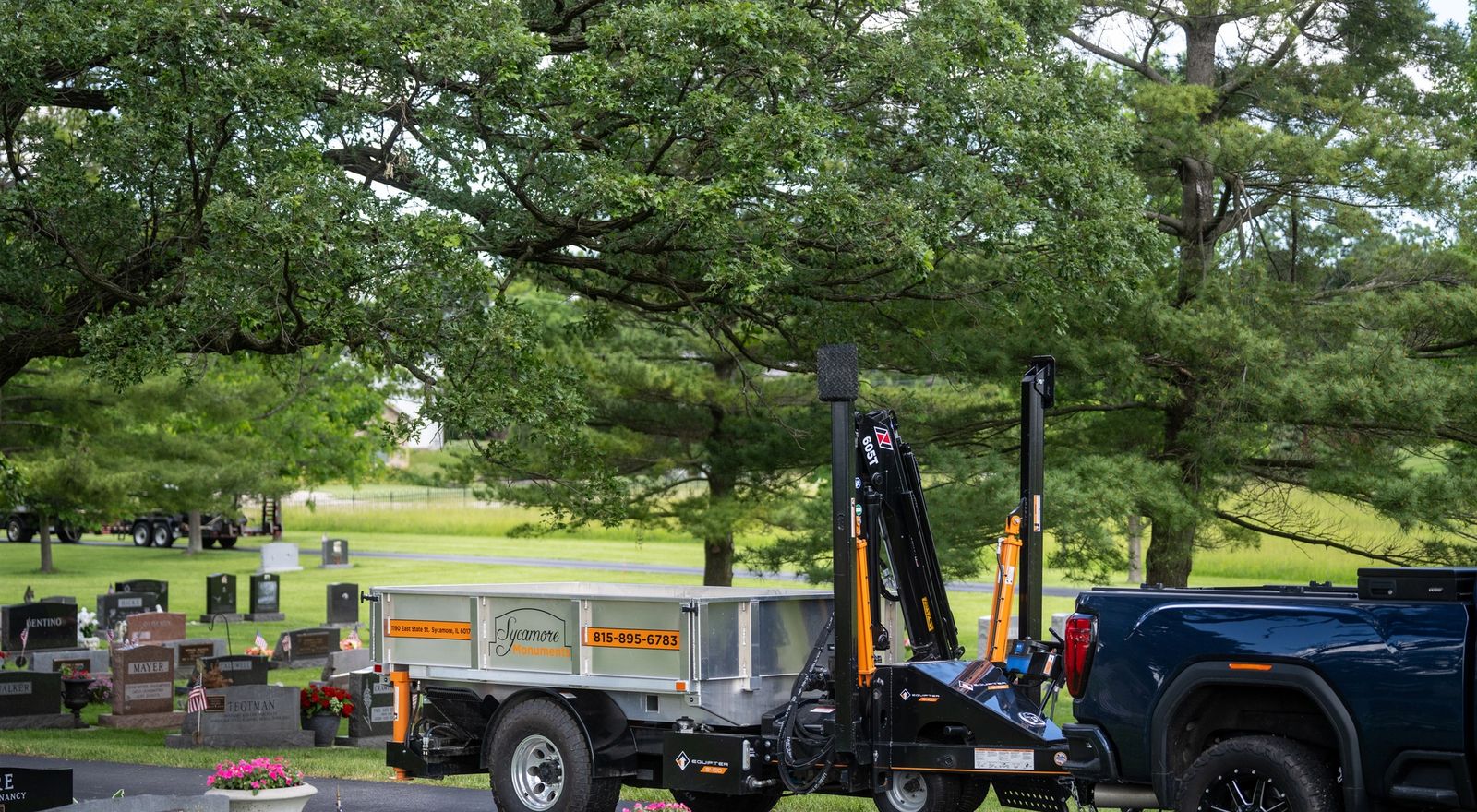 Equipter 5400 towed behind a pickup on a narrow road