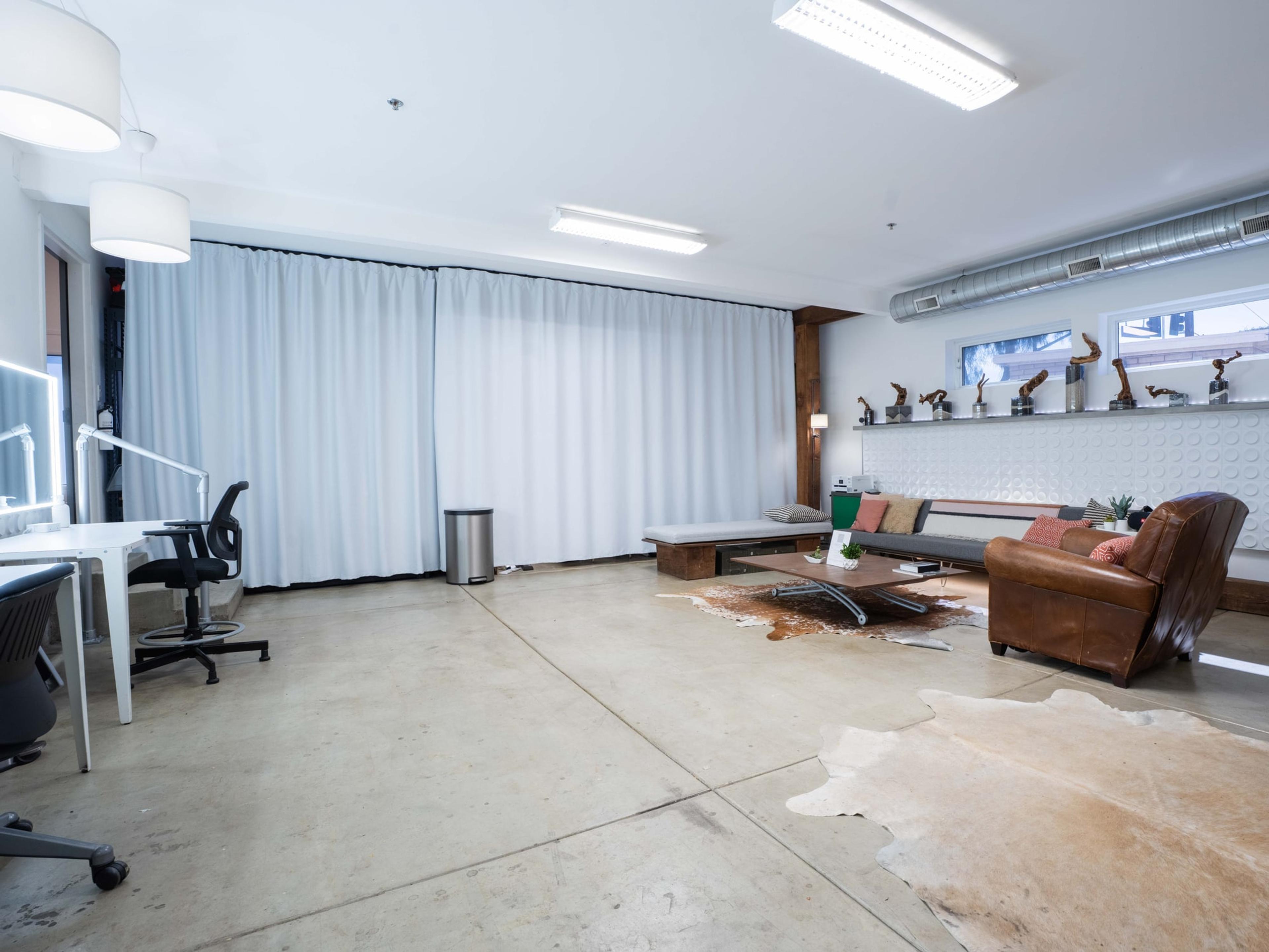 Screening lounge with sectional seating facing a wide window