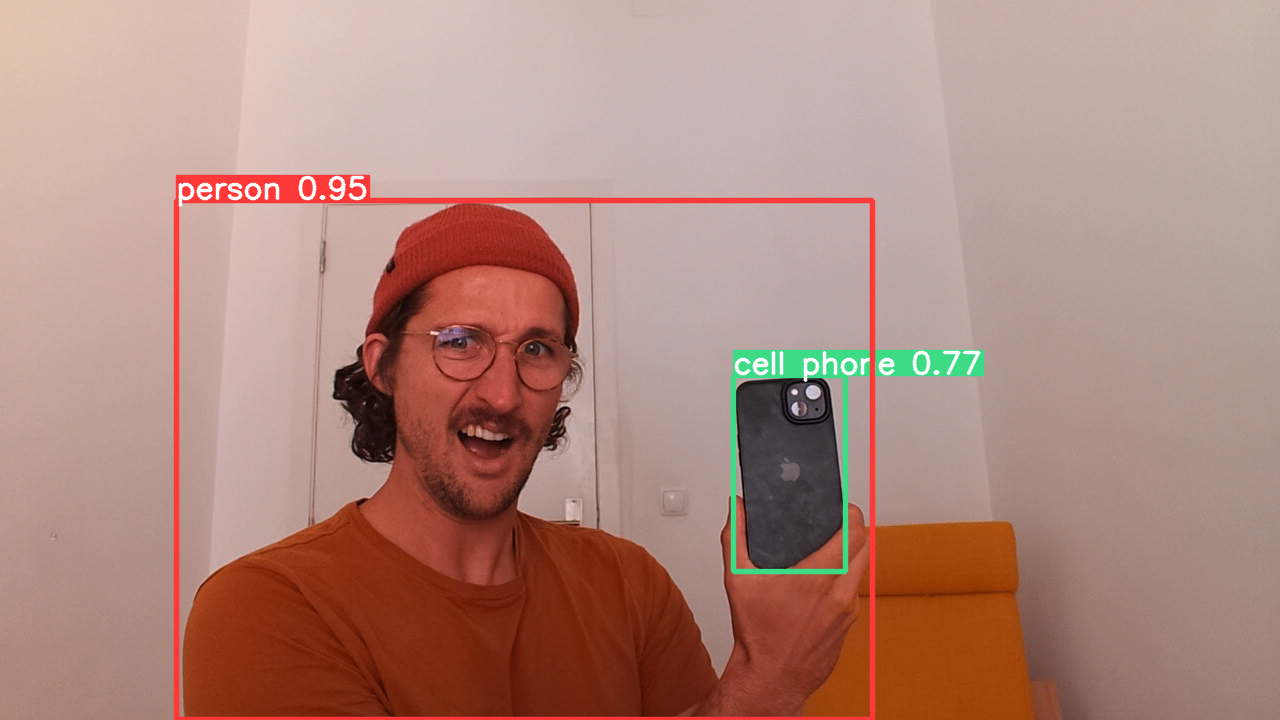 A YouTube thumbnail of Creative Technologist Christian Kastner and his phone being recognized by the YOLO algorithm