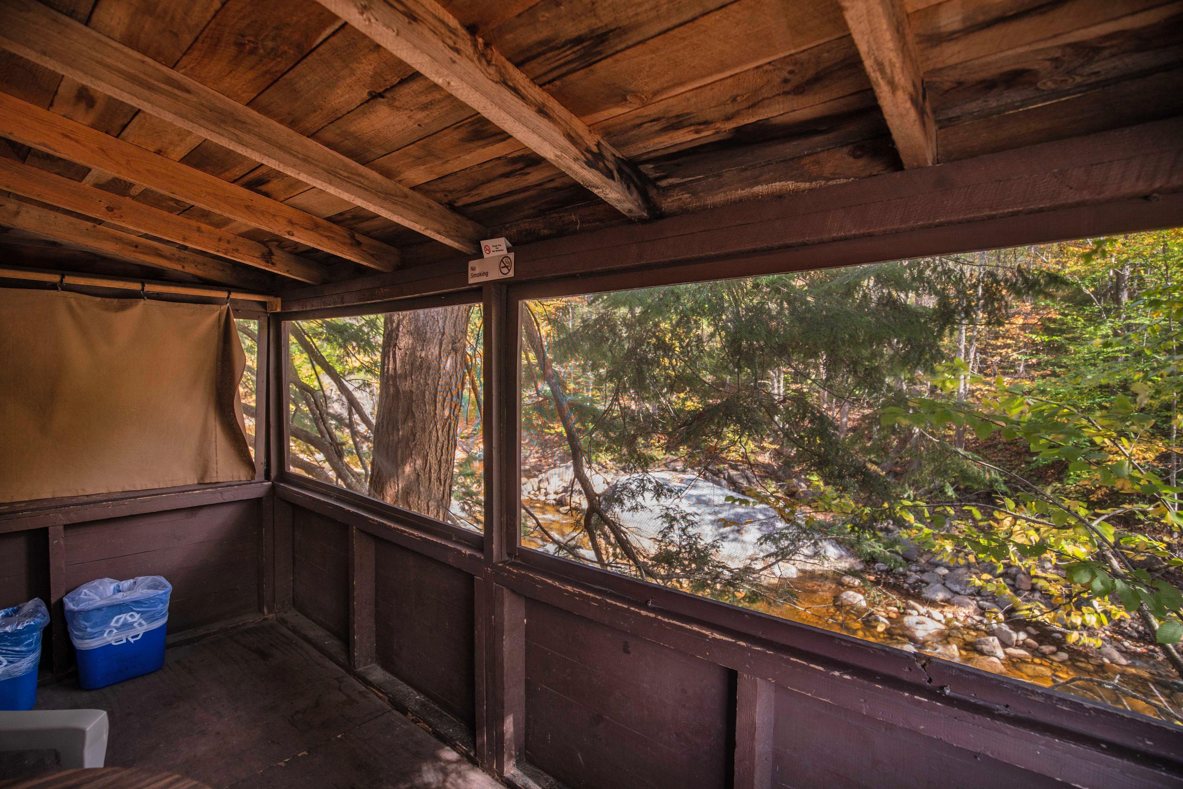 The River Otter cabin, located behind the main red house at Pemi Cabins. #VacationRental #MountainRetreat #RomanticGetaway #UnforgettableGetaway