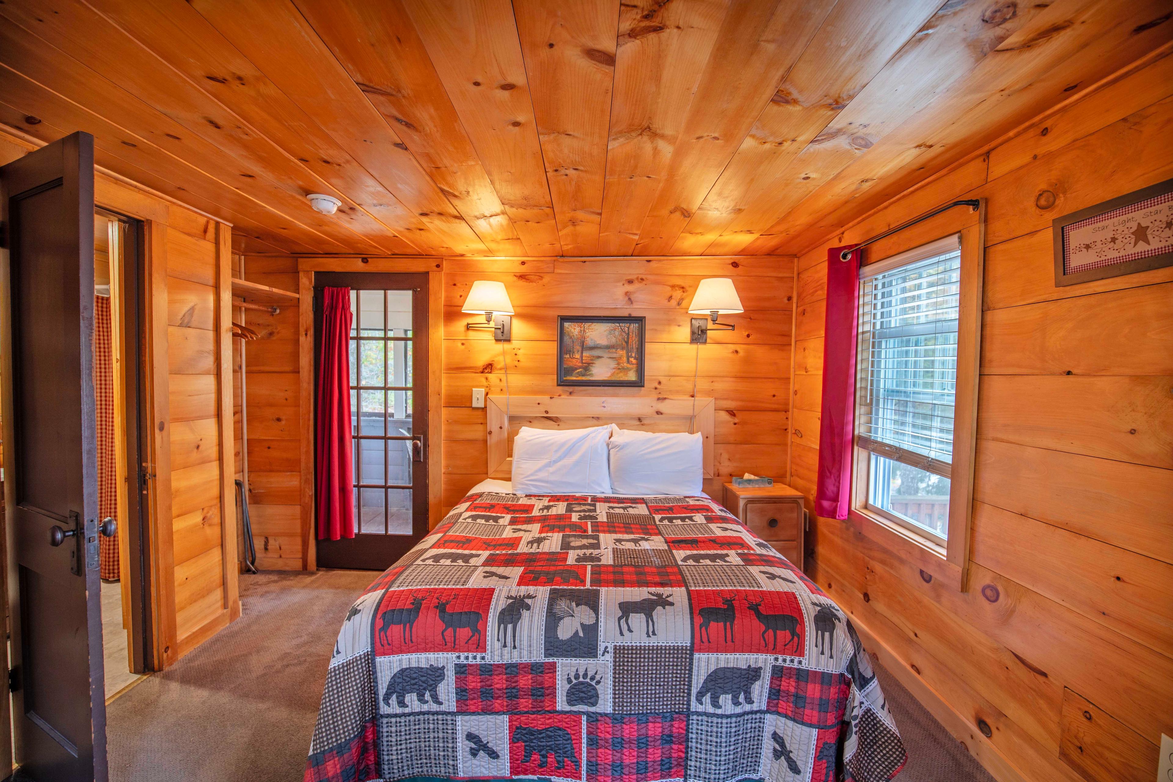 Bedroom with plush queen-sized bed for a restful night's sleep at Lost River. #HiddenGem #NatureBeauty #AdventureAwaits #EscapeToNature