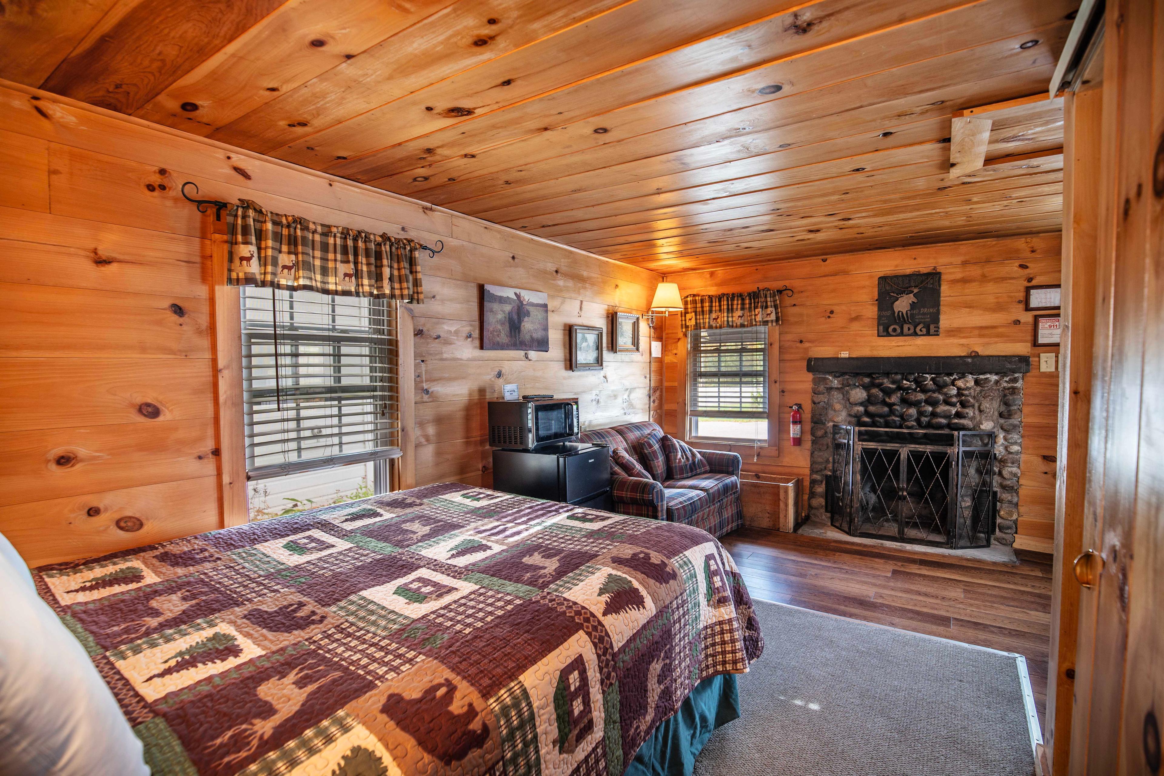 Cozy up by the wood-burning fireplace with mantle at The Flume cabin. #HiddenGem #NatureBeauty #AdventureAwaits