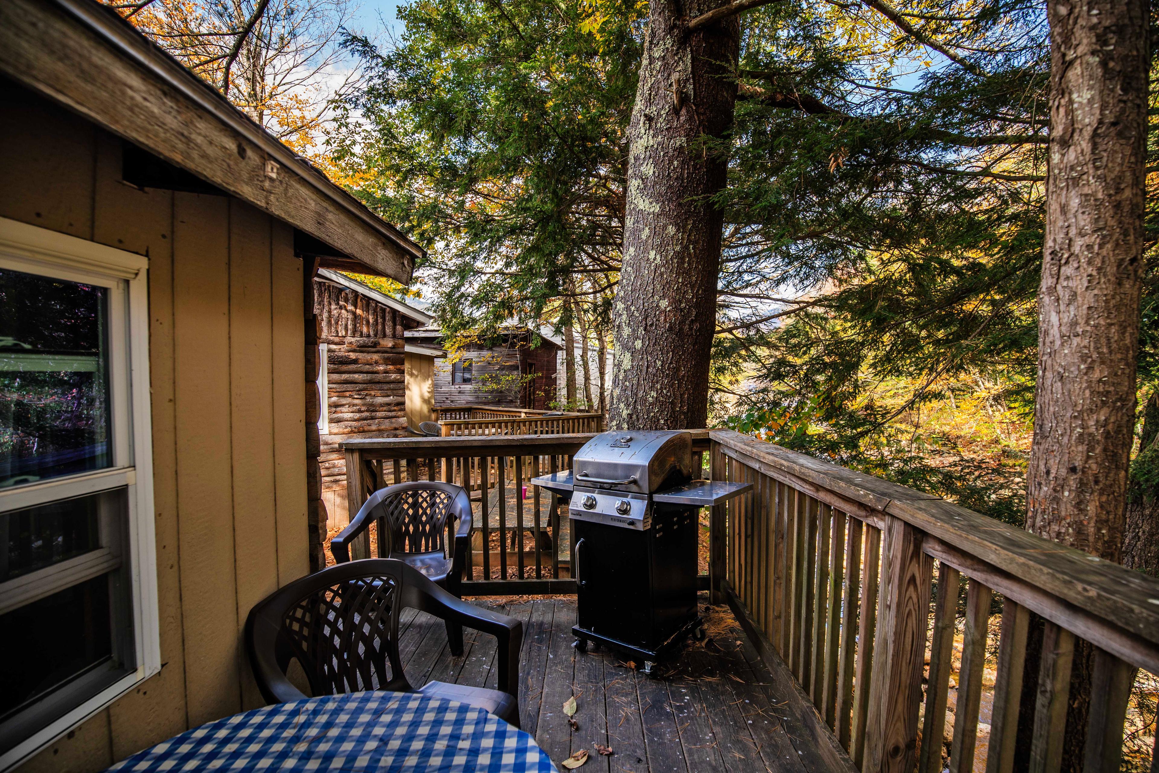 Enjoy a cookout on the deck overlooking the Pemigewasset River at Eagle Cliff. #WhiteMountains #FamilyGetaway #GroupTravel #CozyRetreat