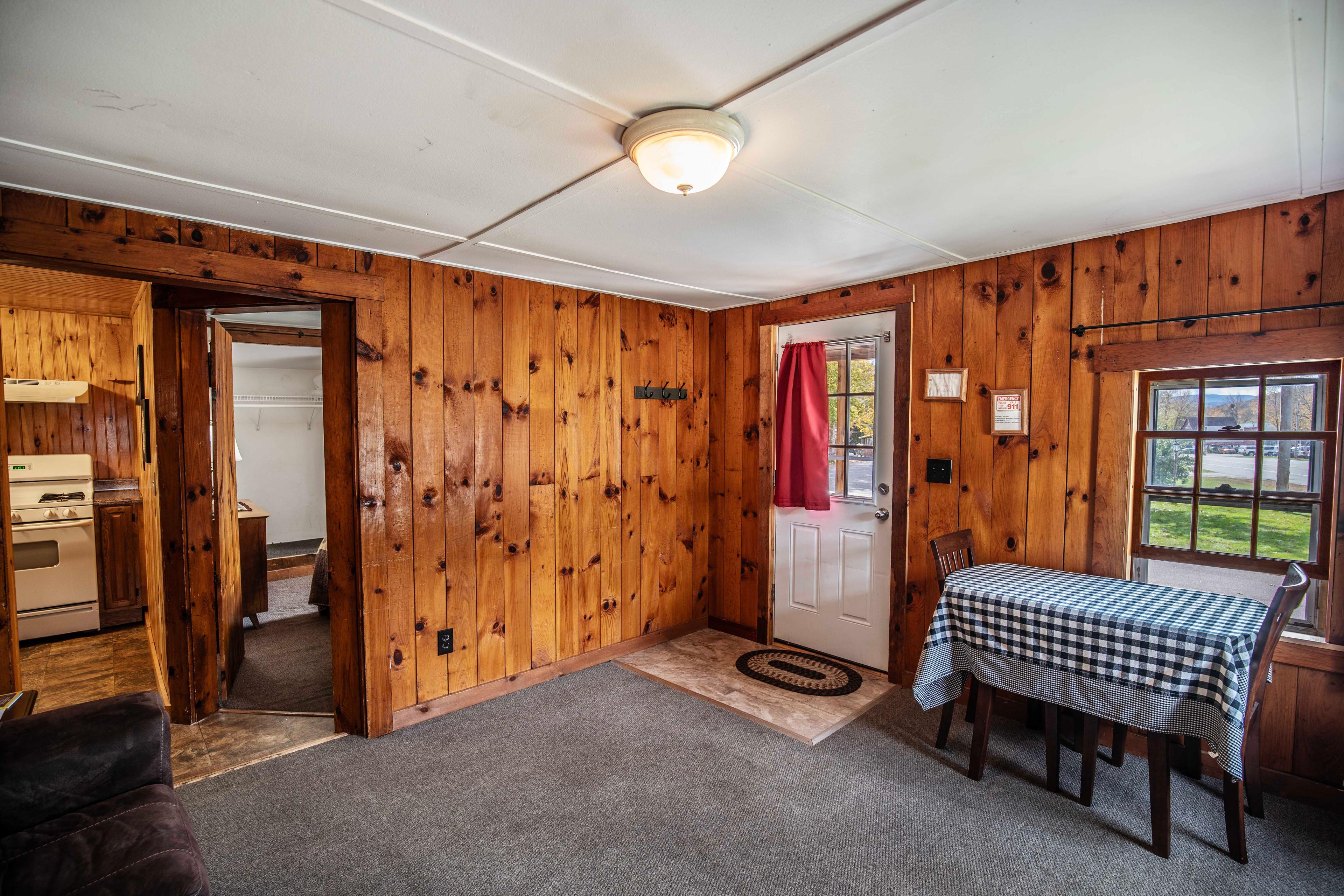 Charming rustic decor in The Pemi Trail cabin's living space. #MountainViews #AirbnbCabin #VacationRental #TravelNewHampshire