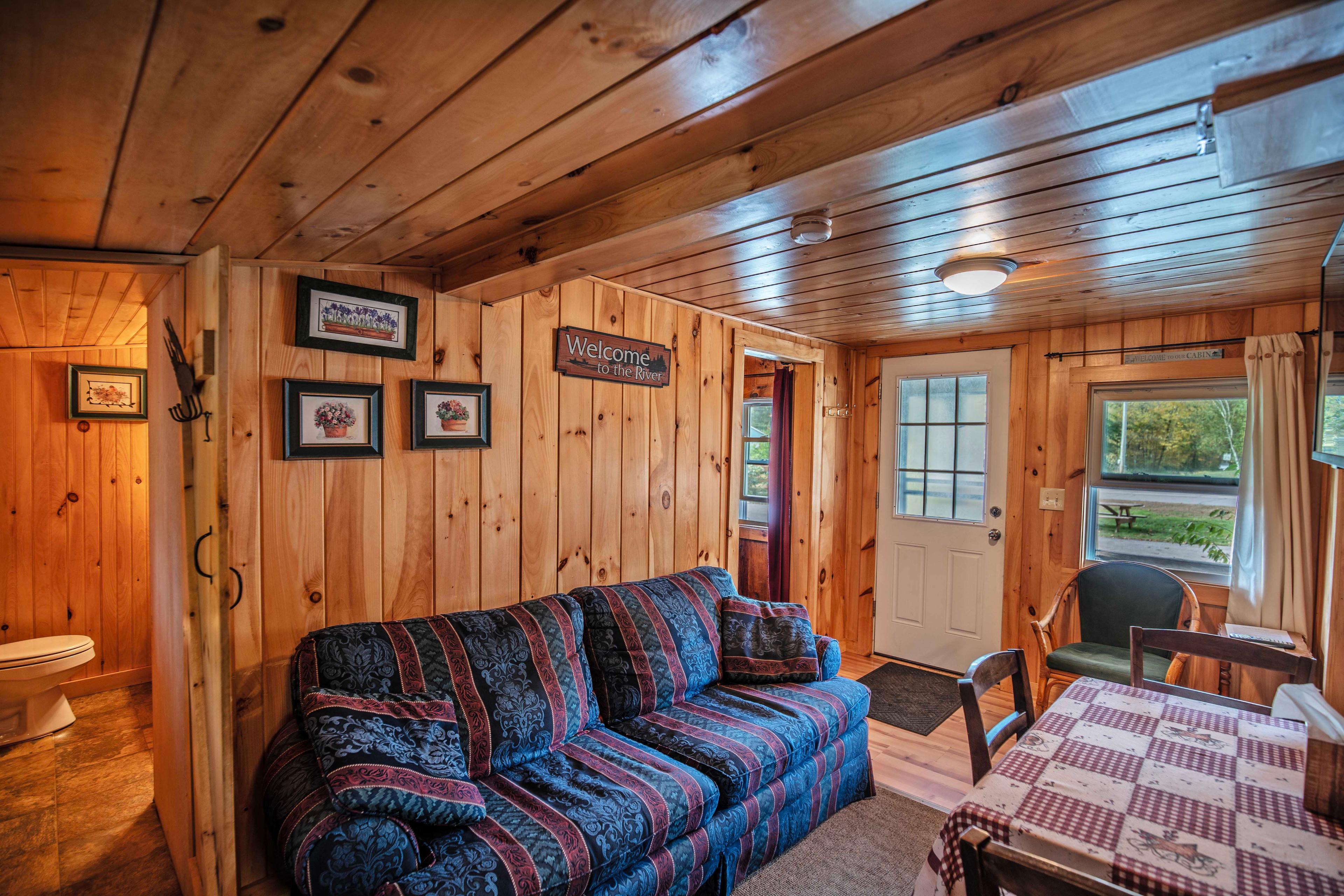 Fans provided for cooling during warmer months at Eagle Cliff cabin. #YearRoundComfort #RiverfrontViews #NatureEscape #ExploreNH