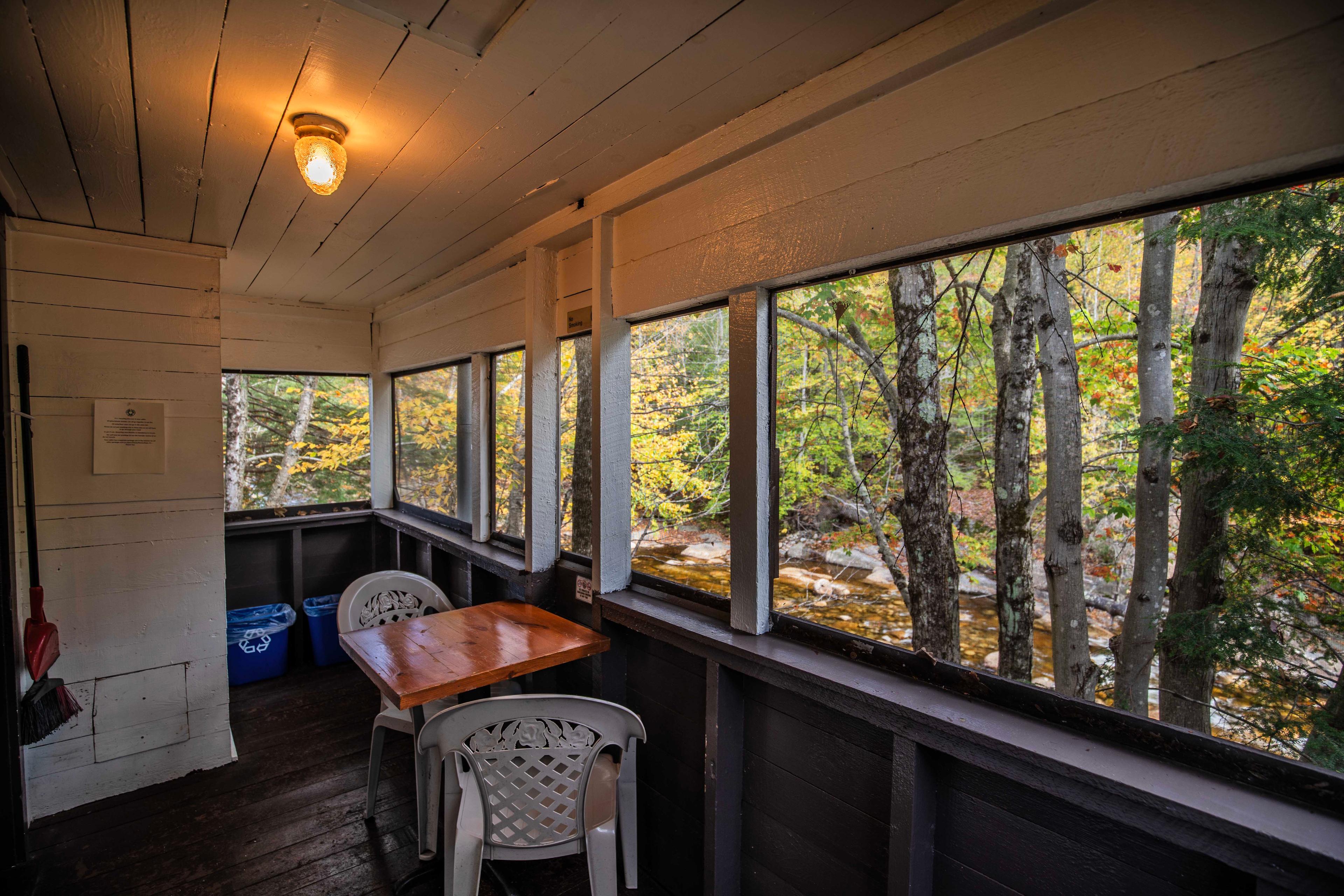 Perfect spot for a romantic dinner with river views at Lost River cabin. #RiverViews #PeacefulRetreat #FirewoodAvailable #RomanticCabin