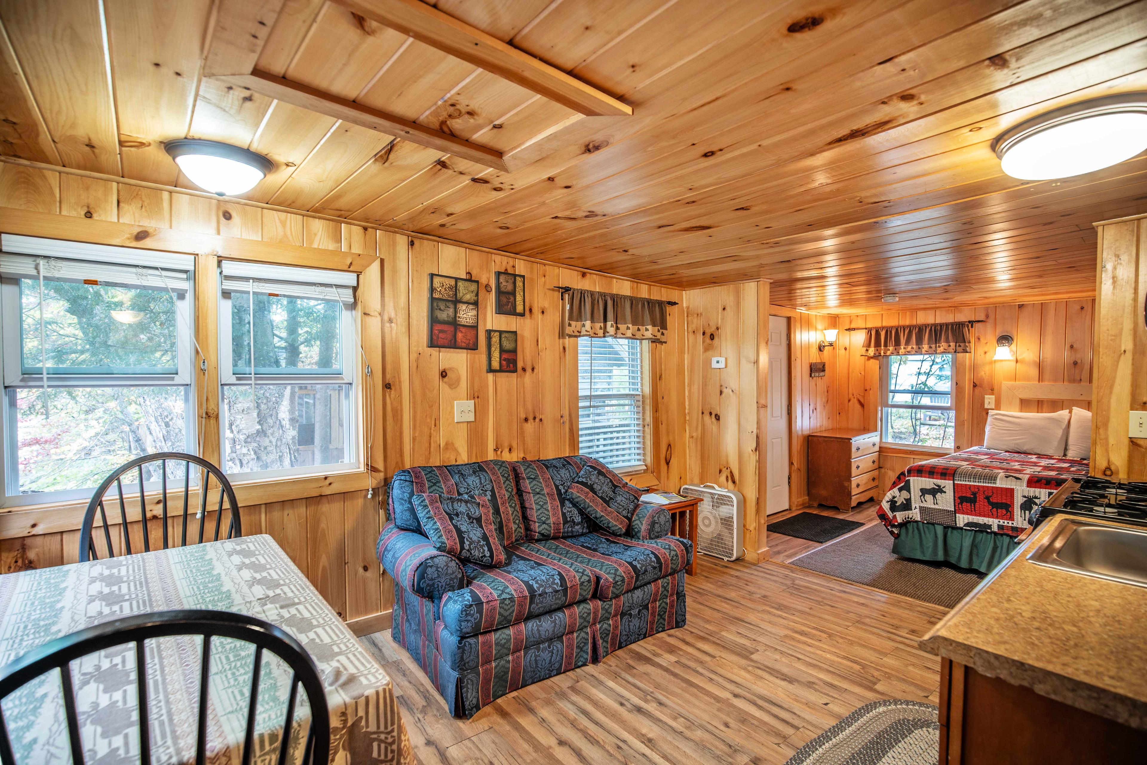 Riverfront cabin with all the comforts of home at Fox Hollow. #RomanticRetreat #ScenicDeck #MorningCoffee #EveningRelaxation