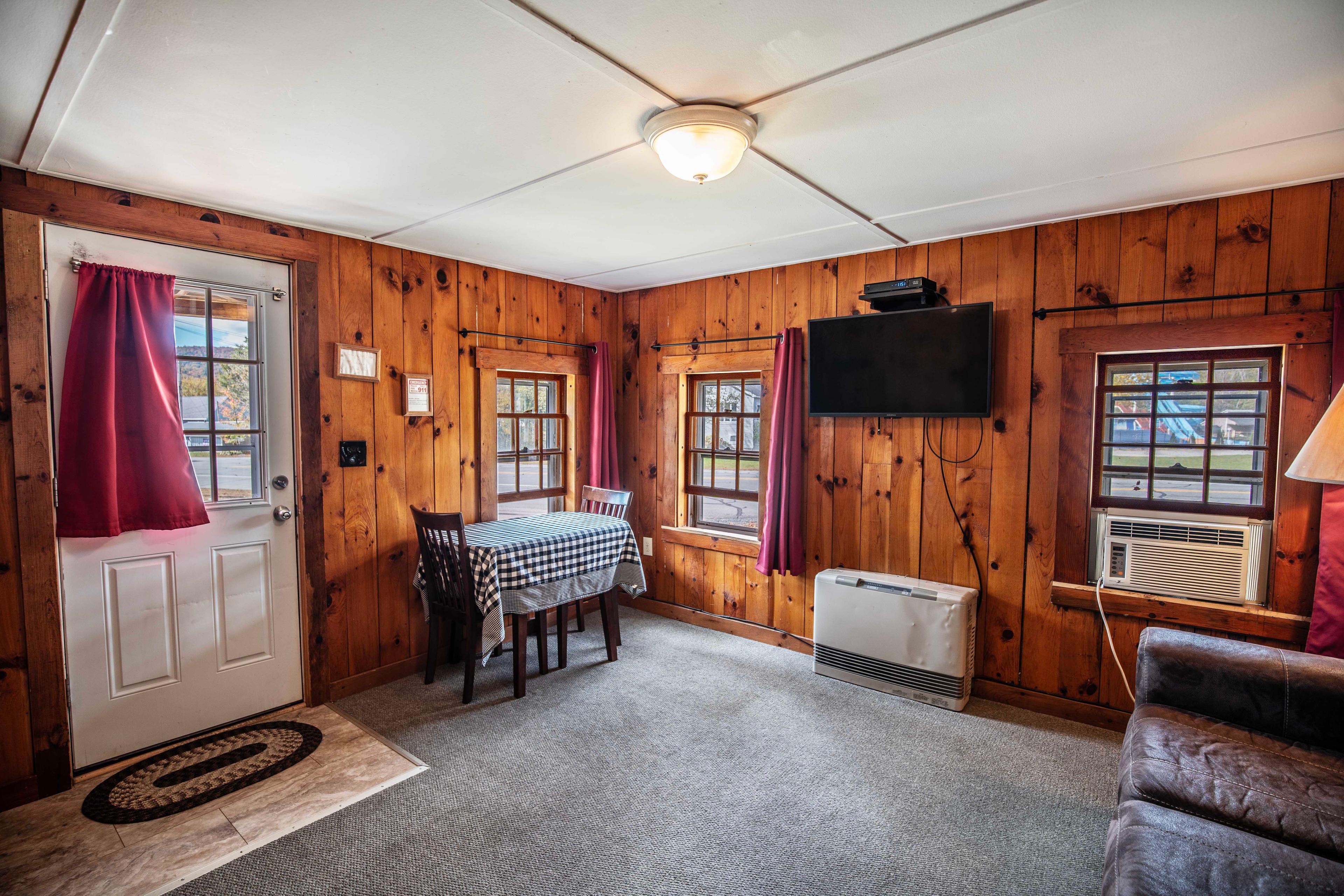 Cozy living room in The Pemi Trail cabin at Pemi Cabins, Lincoln NH. #ExploreNH #WeekendGetaway #Staycation #NatureLovers