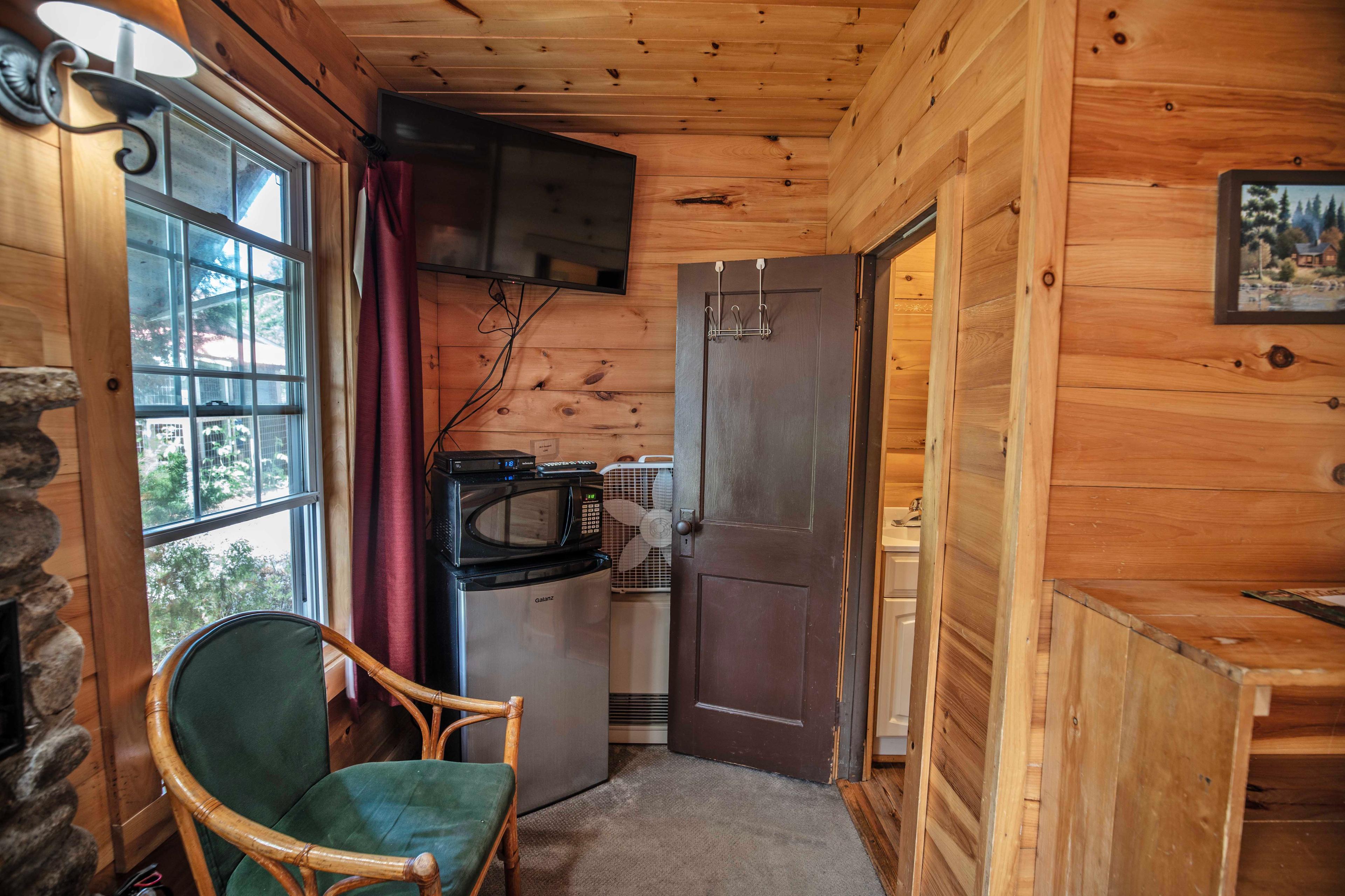 Morning coffee spot on the screened-in porch of The River Otter cabin. #RomanticCabin #ScenicPorch #RiverViews #PeacefulRetreat