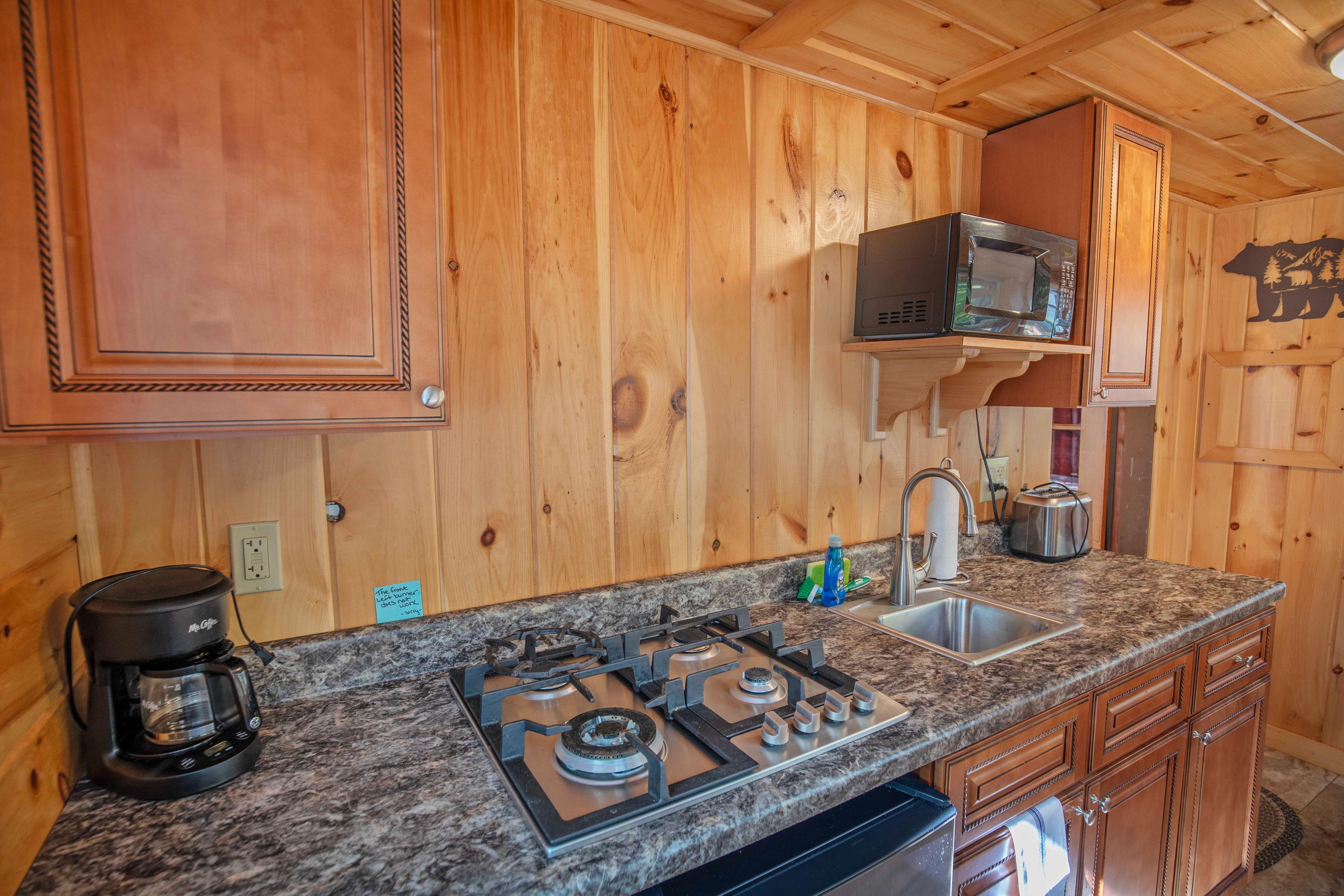 Nature retreat with modern comforts at Falling Waters cabin. #CabinGetaway #ScenicViews #YearRoundComfort #VacationRental #MountainRetreat