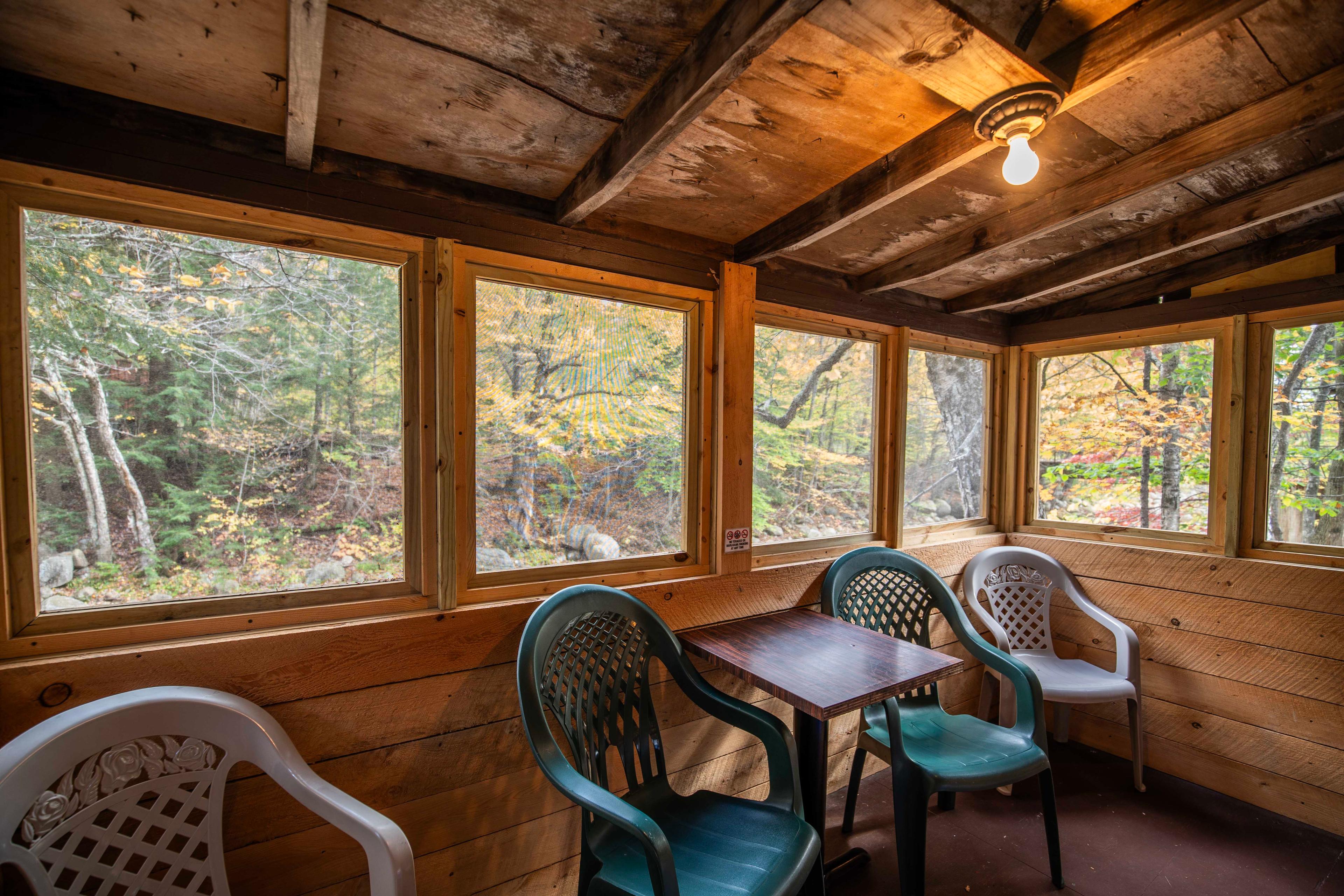 Unwind by the river at The Moose's Antler, a charming cabin at Pemi Cabins. #MountainRetreat #PeacefulEscape #UnforgettableGetaway #CabinInTheWoods