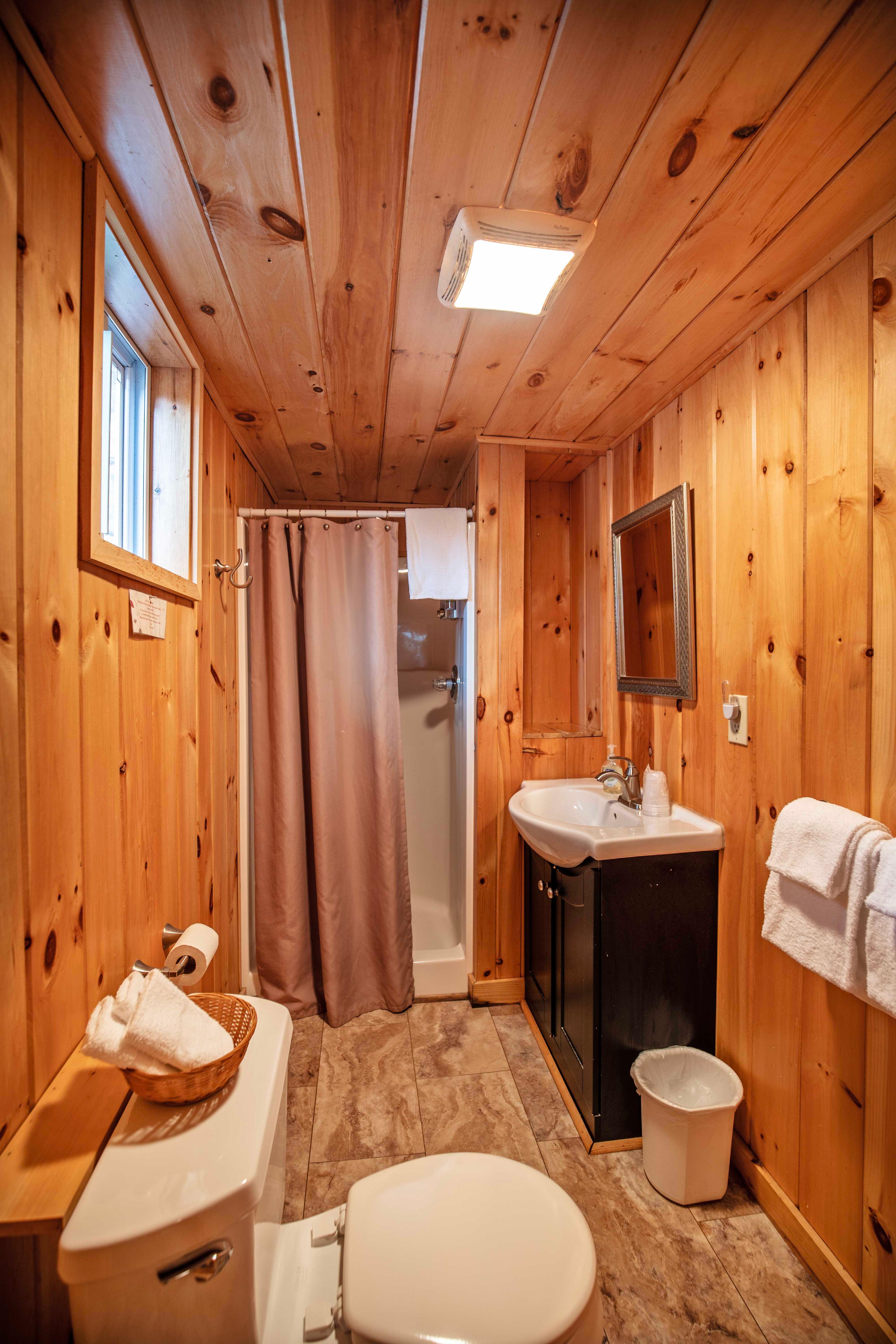 Full bathroom with stand-up shower in Fox Hollow cabin. #FullyEquippedKitchen #CozyLivingRoom #FullBathroom #HiddenGem