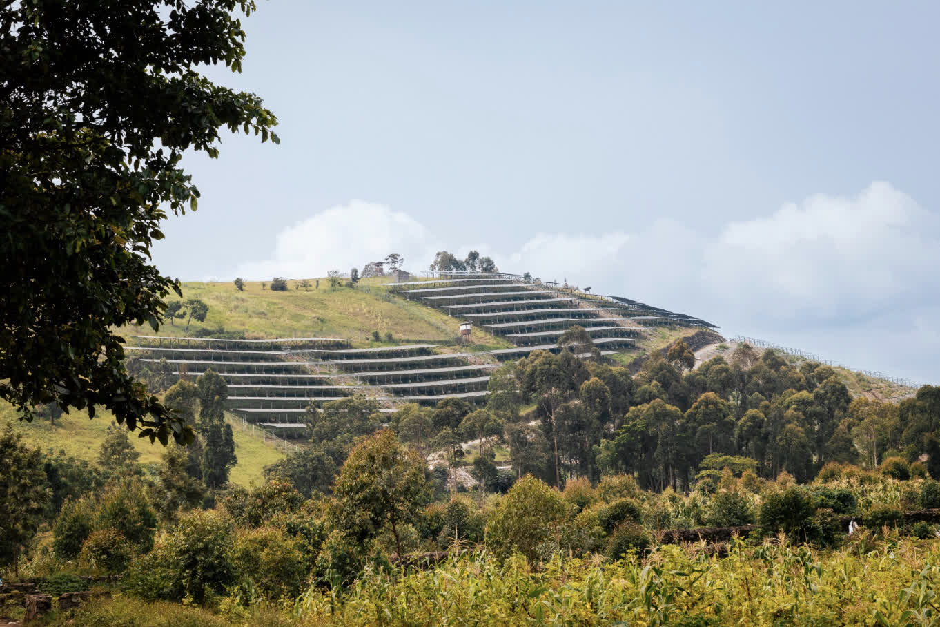 Terraced solar farm on a green hillside with trees and vegetation.​​​​‌﻿‍﻿​‍​‍‌‍﻿﻿‌﻿​‍‌‍‍‌‌‍‌﻿‌‍‍‌‌‍﻿‍​‍​‍​﻿‍‍​‍​‍‌﻿​﻿‌‍​‌‌‍﻿‍‌‍‍‌‌﻿‌​‌﻿‍‌​‍﻿‍‌‍‍‌‌‍﻿﻿​‍​‍​‍﻿​​‍​‍‌‍‍​‌﻿​‍‌‍‌‌‌‍‌‍​‍​‍​﻿‍‍​‍​‍‌‍‍​‌﻿‌​‌﻿‌​‌﻿​​​﻿‍‍​‍﻿﻿​‍﻿﻿‌‍﻿​‌‍﻿﻿‌‍​﻿‌‍​‌‌‍﻿​‌‍‍​‌‍﻿﻿‌﻿​﻿‌﻿‌​​﻿‍‍​﻿​﻿​﻿​﻿​﻿​﻿​﻿​﻿​‍﻿﻿‌‍‍‌‌‍﻿‍‌﻿‌​‌‍‌‌‌‍﻿‍‌﻿‌​​‍﻿﻿‌‍‌‌‌‍‌​‌‍‍‌‌﻿‌​​‍﻿﻿‌‍﻿‌‌‍﻿﻿‌‍‌​‌‍‌‌​﻿﻿‌‌﻿​​‌﻿​‍‌‍‌‌‌﻿​﻿‌‍‌‌‌‍﻿‍‌﻿‌​‌‍​‌‌﻿‌​‌‍‍‌‌‍﻿﻿‌‍﻿‍​﻿‍﻿‌‍‍‌‌‍‌​​﻿﻿‌‌‍‌‍​﻿​‌​﻿‍​​﻿​‍‌‍‌‌​﻿‌​​﻿‍​​﻿​‍​‍﻿‌‌‍​‍‌‍​﻿​﻿‌‌​﻿​‍​‍﻿‌​﻿‌​​﻿‍​​﻿‍​‌‍​‌​‍﻿‌​﻿‍​‌‍‌‌‌‍‌‍‌‍​‌​‍﻿‌‌‍‌​​﻿‌‍‌‍​﻿​﻿‌‌​﻿​​‌‍​‍‌‍‌‌‌‍​‍‌‍​‌​﻿‌‍​﻿​‍​﻿‍‌​﻿‍﻿‌﻿‌​‌﻿‍‌‌﻿​​‌‍‌‌​﻿﻿‌‌﻿​​‌‍﻿​‌‍​‌‌﻿‌​‌‍‌‍‌‍﻿﻿‌﻿​‍‌‍﻿‌​﻿‍﻿‌﻿​​‌‍​‌‌﻿‌​‌‍‍​​﻿﻿‌‌‍​‍‌﻿‌‌‌‍‍‌‌‍﻿​‌‍‌​‌‍‌‌‌﻿​‍​‍‌‌​﻿‌‌‌​​‍‌‌﻿﻿‌‍‍﻿‌‍‌‌‌﻿‍‌​‍‌‌​﻿​﻿‌​‌​​‍‌‌​﻿​﻿‌​‌​​‍‌‌​﻿​‍​﻿​‍​﻿‌﻿‌‍​‌‌‍​‍‌‍‌‌​﻿‌‍‌‍‌‍​﻿​‌‌‍‌​‌‍​‍​﻿​​​﻿‌‌​﻿​﻿​‍‌‌​﻿​‍​﻿​‍​‍‌‌​﻿‌‌‌​‌​​‍﻿‍‌‍‍‌‌‍﻿‌‌‍​‌‌‍‌﻿‌‍‌‌​‍﻿‍‌‍​‌‌‍﻿​‌﻿‌​​﻿﻿﻿‌‍​‍‌‍​‌‌﻿​﻿‌‍‌‌‌‌‌‌‌﻿​‍‌‍﻿​​﻿﻿‌‌‍‍​‌﻿‌​‌﻿‌​‌﻿​​​‍‌‌​﻿​﻿‌​​‌​‍‌‌​﻿​‍‌​‌‍​‍‌‌​﻿​‍‌​‌‍‌‍﻿​‌‍﻿﻿‌‍​﻿‌‍​‌‌‍﻿​‌‍‍​‌‍﻿﻿‌﻿​﻿‌﻿‌​​‍‌‌​﻿​﻿‌​​‌​﻿​﻿​﻿​﻿​﻿​﻿​﻿​﻿​‍‌‍‌‍‍‌‌‍‌​​﻿﻿‌‌‍‌‍​﻿​‌​﻿‍​​﻿​‍‌‍‌‌​﻿‌​​﻿‍​​﻿​‍​‍﻿‌‌‍​‍‌‍​﻿​﻿‌‌​﻿​‍​‍﻿‌​﻿‌​​﻿‍​​﻿‍​‌‍​‌​‍﻿‌​﻿‍​‌‍‌‌‌‍‌‍‌‍​‌​‍﻿‌‌‍‌​​﻿‌‍‌‍​﻿​﻿‌‌​﻿​​‌‍​‍‌‍‌‌‌‍​‍‌‍​‌​﻿‌‍​﻿​‍​﻿‍‌​‍‌‍‌﻿‌​‌﻿‍‌‌﻿​​‌‍‌‌​﻿﻿‌‌﻿​​‌‍﻿​‌‍​‌‌﻿‌​‌‍‌‍‌‍﻿﻿‌﻿​‍‌‍﻿‌​‍‌‍‌﻿​​‌‍​‌‌﻿‌​‌‍‍​​﻿﻿‌‌‍​‍‌﻿‌‌‌‍‍‌‌‍﻿​‌‍‌​‌‍‌‌‌﻿​‍​‍‌‌​﻿‌‌‌​​‍‌‌﻿﻿‌‍‍﻿‌‍‌‌‌﻿‍‌​‍‌‌​﻿​﻿‌​‌​​‍‌‌​﻿​﻿‌​‌​​‍‌‌​﻿​‍​﻿​‍​﻿‌﻿‌‍​‌‌‍​‍‌‍‌‌​﻿‌‍‌‍‌‍​﻿​‌‌‍‌​‌‍​‍​﻿​​​﻿‌‌​﻿​﻿​‍‌‌​﻿​‍​﻿​‍​‍‌‌​﻿‌‌‌​‌​​‍﻿‍‌‍‍‌‌‍﻿‌‌‍​‌‌‍‌﻿‌‍‌‌​‍﻿‍‌‍​‌‌‍﻿​‌﻿‌​​‍‌‍‌﻿​​‌‍‌‌‌﻿​‍‌﻿​﻿‌﻿​​‌‍‌‌‌‍​﻿‌﻿‌​‌‍‍‌‌﻿‌‍‌‍‌‌​﻿﻿‌‌﻿​​‌﻿‌‌‌‍​‍‌‍﻿​‌‍‍‌‌﻿​﻿‌‍‍​‌‍‌‌‌‍‌​​‍​‍‌﻿﻿‌