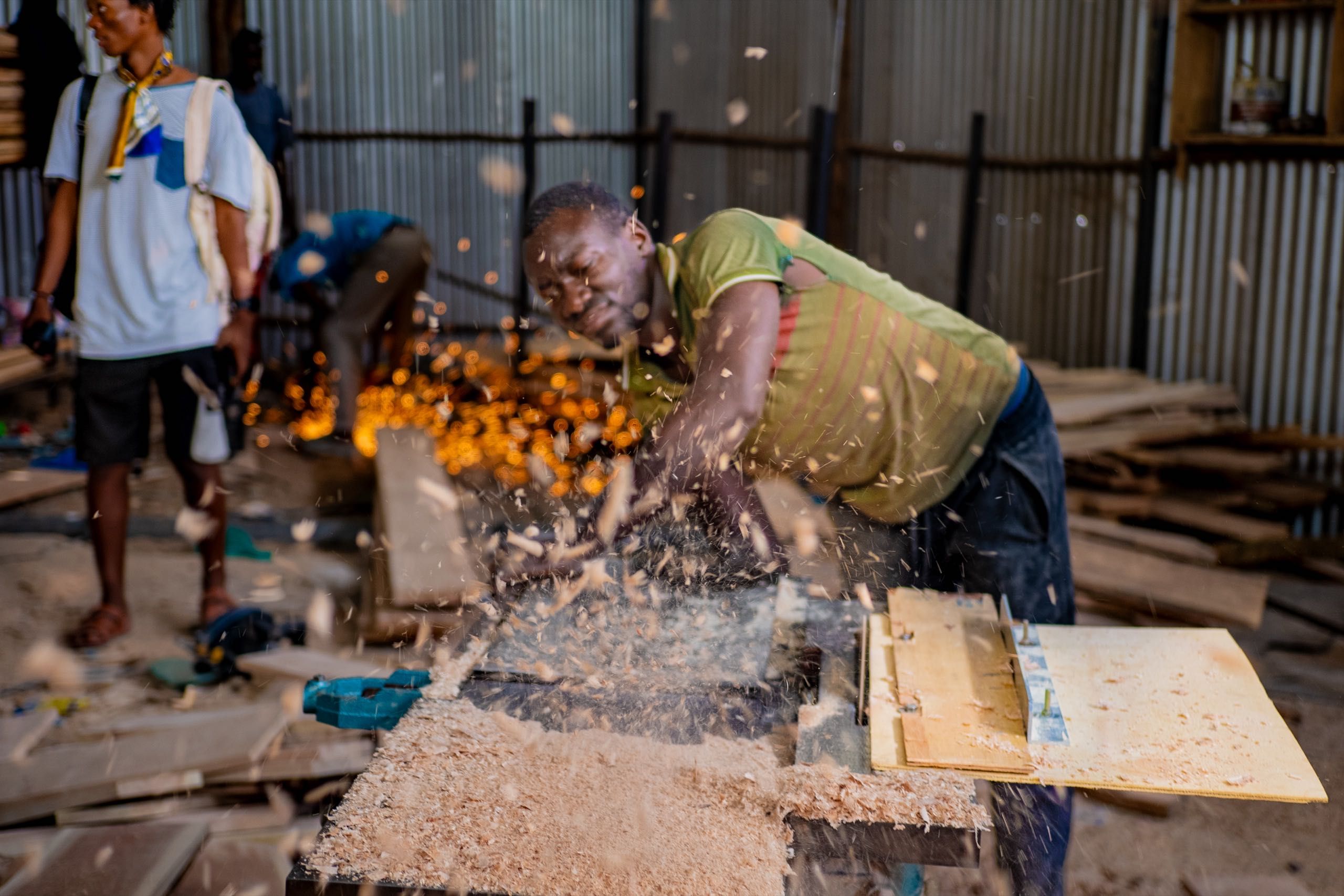 A man cuts wood with a saw, sending sawdust flying, while sparks illuminate another worker in the background of a busy workshop.​​​​‌﻿‍﻿​‍​‍‌‍﻿﻿‌﻿​‍‌‍‍‌‌‍‌﻿‌‍‍‌‌‍﻿‍​‍​‍​﻿‍‍​‍​‍‌﻿​﻿‌‍​‌‌‍﻿‍‌‍‍‌‌﻿‌​‌﻿‍‌​‍﻿‍‌‍‍‌‌‍﻿﻿​‍​‍​‍﻿​​‍​‍‌‍‍​‌﻿​‍‌‍‌‌‌‍‌‍​‍​‍​﻿‍‍​‍​‍‌‍‍​‌﻿‌​‌﻿‌​‌﻿​​​﻿‍‍​‍﻿﻿​‍﻿﻿‌‍﻿​‌‍﻿﻿‌‍​﻿‌‍​‌‌‍﻿​‌‍‍​‌‍﻿﻿‌﻿​﻿‌﻿‌​​﻿‍‍​﻿​﻿​﻿​﻿​﻿​﻿​﻿​﻿​‍﻿﻿‌‍‍‌‌‍﻿‍‌﻿‌​‌‍‌‌‌‍﻿‍‌﻿‌​​‍﻿﻿‌‍‌‌‌‍‌​‌‍‍‌‌﻿‌​​‍﻿﻿‌‍﻿‌‌‍﻿﻿‌‍‌​‌‍‌‌​﻿﻿‌‌﻿​​‌﻿​‍‌‍‌‌‌﻿​﻿‌‍‌‌‌‍﻿‍‌﻿‌​‌‍​‌‌﻿‌​‌‍‍‌‌‍﻿﻿‌‍﻿‍​﻿‍﻿‌‍‍‌‌‍‌​​﻿﻿‌​﻿​​​﻿‍​‌‍‌​​﻿​‍​﻿​‍​﻿​​​﻿​‍​﻿‌‌​‍﻿‌‌‍‌‍​﻿​﻿‌‍‌‌​﻿​​​‍﻿‌​﻿‌​​﻿​﻿​﻿‌​‌‍​‍​‍﻿‌​﻿‍​‌‍‌‍​﻿​﻿‌‍​﻿​‍﻿‌​﻿​‌‌‍​‍​﻿‌​‌‍‌‍‌‍​‌​﻿‌‌​﻿​​​﻿​﻿​﻿‍‌​﻿‌‍​﻿‍​​﻿‌‍​﻿‍﻿‌﻿‌​‌﻿‍‌‌﻿​​‌‍‌‌​﻿﻿‌‌‍​﻿‌‍​‌‌﻿​﻿‌‍‌‌‌‌​﻿‌﻿‌​‌﻿‌‌‌‍‌​‌﻿‍‌​﻿‍﻿‌﻿​​‌‍​‌‌﻿‌​‌‍‍​​﻿﻿‌‌‍​‍‌‍﻿﻿‌‍‌​‌﻿‍‌​‍‌‌​﻿‌‌‌​​‍‌‌﻿﻿‌‍‍﻿‌‍‌‌‌﻿‍‌​‍‌‌​﻿​﻿‌​‌​​‍‌‌​﻿​﻿‌​‌​​‍‌‌​﻿​‍​﻿​‍​﻿​‌​﻿‌​​﻿‌​​﻿‌​​﻿‌‌​﻿‍​​﻿‍​‌‍‌‍‌‍‌​‌‍‌‍​﻿​﻿​﻿​‌​‍‌‌​﻿​‍​﻿​‍​‍‌‌​﻿‌‌‌​‌​​‍﻿‍‌‍‍‌‌‍﻿‌‌‍​‌‌‍‌﻿‌‍‌‌​‍﻿‍‌‍​‌‌‍﻿​‌﻿‌​​﻿﻿﻿‌‍​‍‌‍​‌‌﻿​﻿‌‍‌‌‌‌‌‌‌﻿​‍‌‍﻿​​﻿﻿‌‌‍‍​‌﻿‌​‌﻿‌​‌﻿​​​‍‌‌​﻿​﻿‌​​‌​‍‌‌​﻿​‍‌​‌‍​‍‌‌​﻿​‍‌​‌‍‌‍﻿​‌‍﻿﻿‌‍​﻿‌‍​‌‌‍﻿​‌‍‍​‌‍﻿﻿‌﻿​﻿‌﻿‌​​‍‌‌​﻿​﻿‌​​‌​﻿​﻿​﻿​﻿​﻿​﻿​﻿​﻿​‍‌‍‌‍‍‌‌‍‌​​﻿﻿‌​﻿​​​﻿‍​‌‍‌​​﻿​‍​﻿​‍​﻿​​​﻿​‍​﻿‌‌​‍﻿‌‌‍‌‍​﻿​﻿‌‍‌‌​﻿​​​‍﻿‌​﻿‌​​﻿​﻿​﻿‌​‌‍​‍​‍﻿‌​﻿‍​‌‍‌‍​﻿​﻿‌‍​﻿​‍﻿‌​﻿​‌‌‍​‍​﻿‌​‌‍‌‍‌‍​‌​﻿‌‌​﻿​​​﻿​﻿​﻿‍‌​﻿‌‍​﻿‍​​﻿‌‍​‍‌‍‌﻿‌​‌﻿‍‌‌﻿​​‌‍‌‌​﻿﻿‌‌‍​﻿‌‍​‌‌﻿​﻿‌‍‌‌‌‌​﻿‌﻿‌​‌﻿‌‌‌‍‌​‌﻿‍‌​‍‌‍‌﻿​​‌‍​‌‌﻿‌​‌‍‍​​﻿﻿‌‌‍​‍‌‍﻿﻿‌‍‌​‌﻿‍‌​‍‌‌​﻿‌‌‌​​‍‌‌﻿﻿‌‍‍﻿‌‍‌‌‌﻿‍‌​‍‌‌​﻿​﻿‌​‌​​‍‌‌​﻿​﻿‌​‌​​‍‌‌​﻿​‍​﻿​‍​﻿​‌​﻿‌​​﻿‌​​﻿‌​​﻿‌‌​﻿‍​​﻿‍​‌‍‌‍‌‍‌​‌‍‌‍​﻿​﻿​﻿​‌​‍‌‌​﻿​‍​﻿​‍​‍‌‌​﻿‌‌‌​‌​​‍﻿‍‌‍‍‌‌‍﻿‌‌‍​‌‌‍‌﻿‌‍‌‌​‍﻿‍‌‍​‌‌‍﻿​‌﻿‌​​‍‌‍‌﻿​​‌‍‌‌‌﻿​‍‌﻿​﻿‌﻿​​‌‍‌‌‌‍​﻿‌﻿‌​‌‍‍‌‌﻿‌‍‌‍‌‌​﻿﻿‌‌﻿​​‌﻿‌‌‌‍​‍‌‍﻿​‌‍‍‌‌﻿​﻿‌‍‍​‌‍‌‌‌‍‌​​‍​‍‌﻿﻿‌