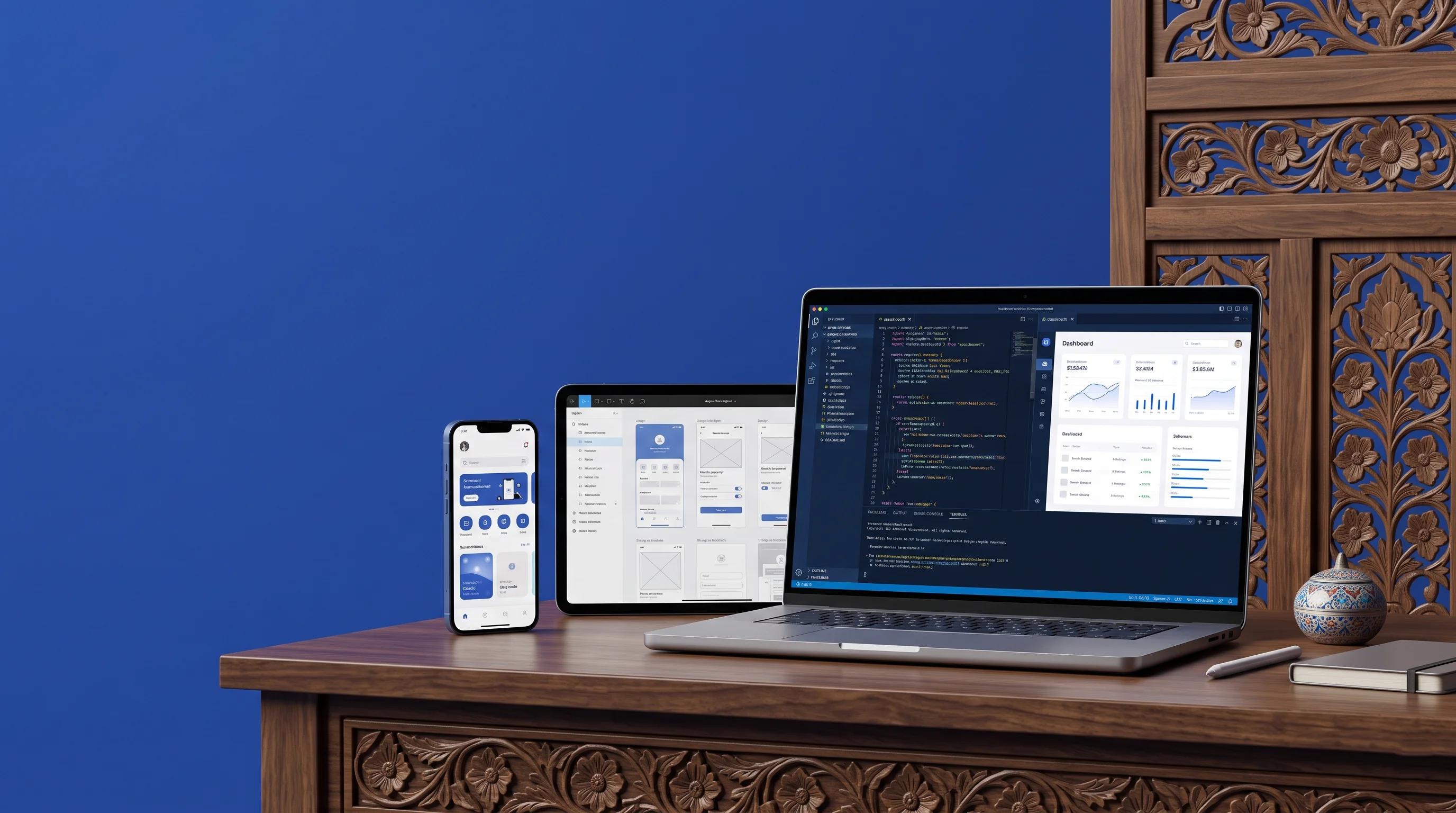 Custom app development in Kashmir, featuring a laptop displaying code and an analytics dashboard alongside mobile and tablet app interfaces.