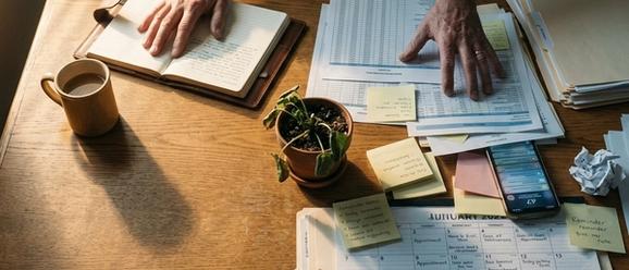 Overwhelmed church staff surrounded by administrative tasks and manual processes
