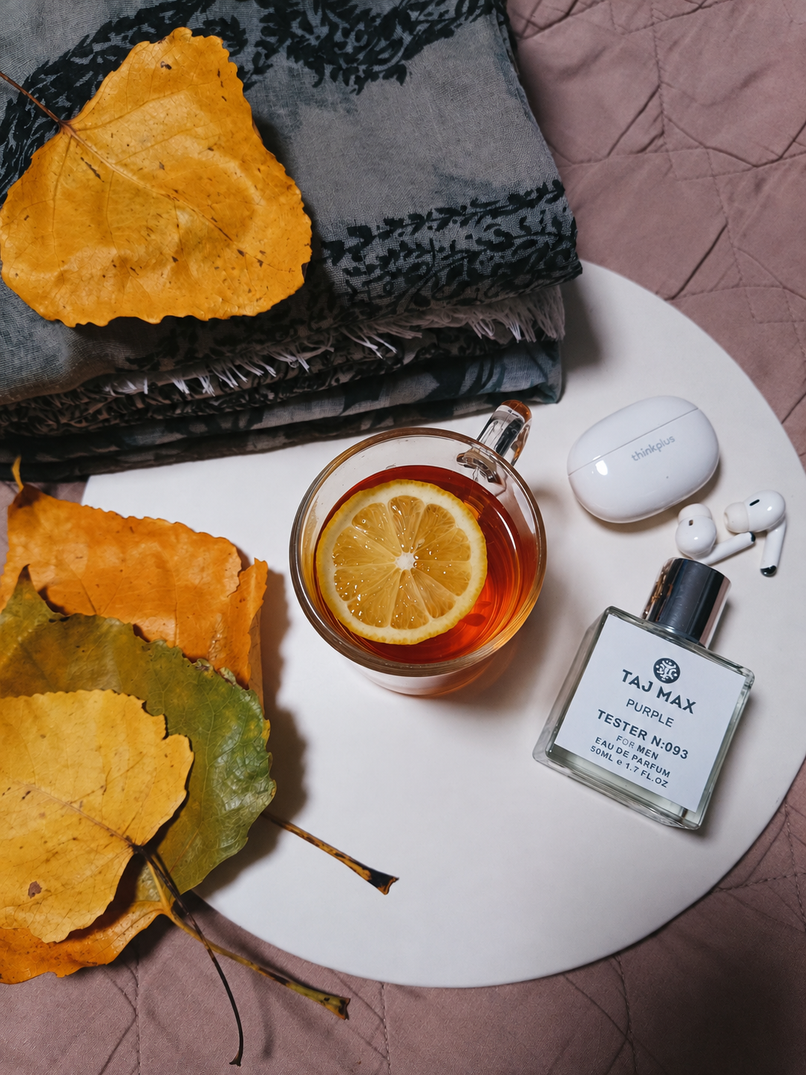 Flat lay of a cozy autumn tea and cologne