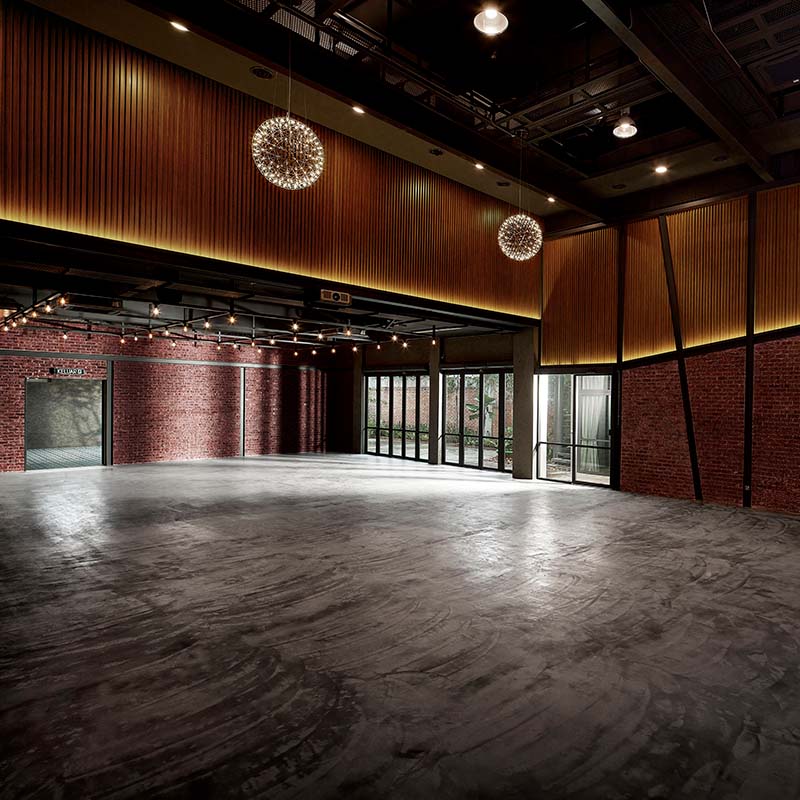 A large, empty event venue with an industrial-chic design