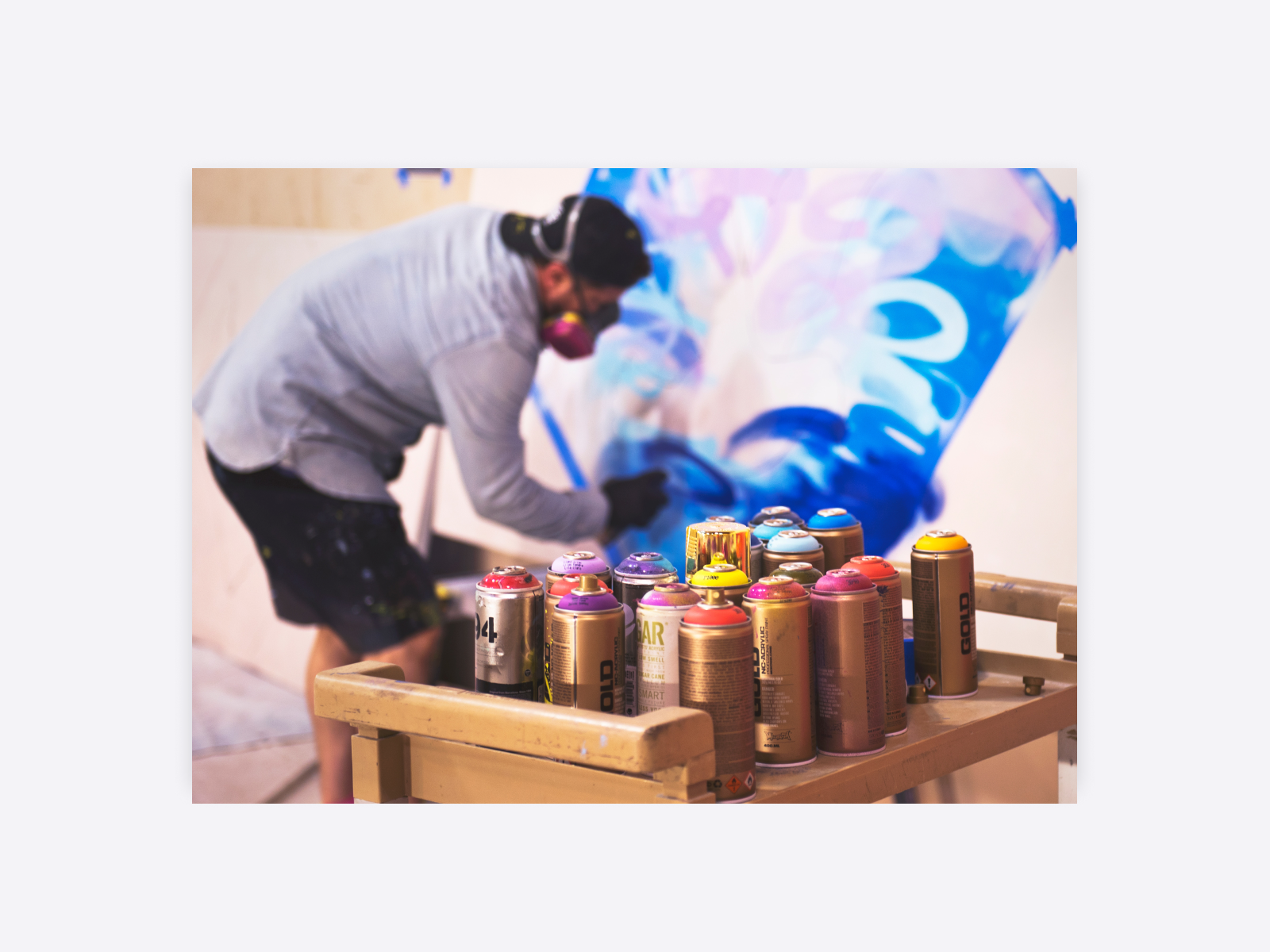 Illustration showing an artist creating artwork with spray paint.