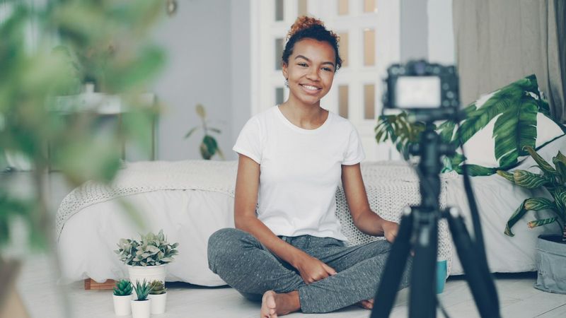 Creator recording video content at home with a camera