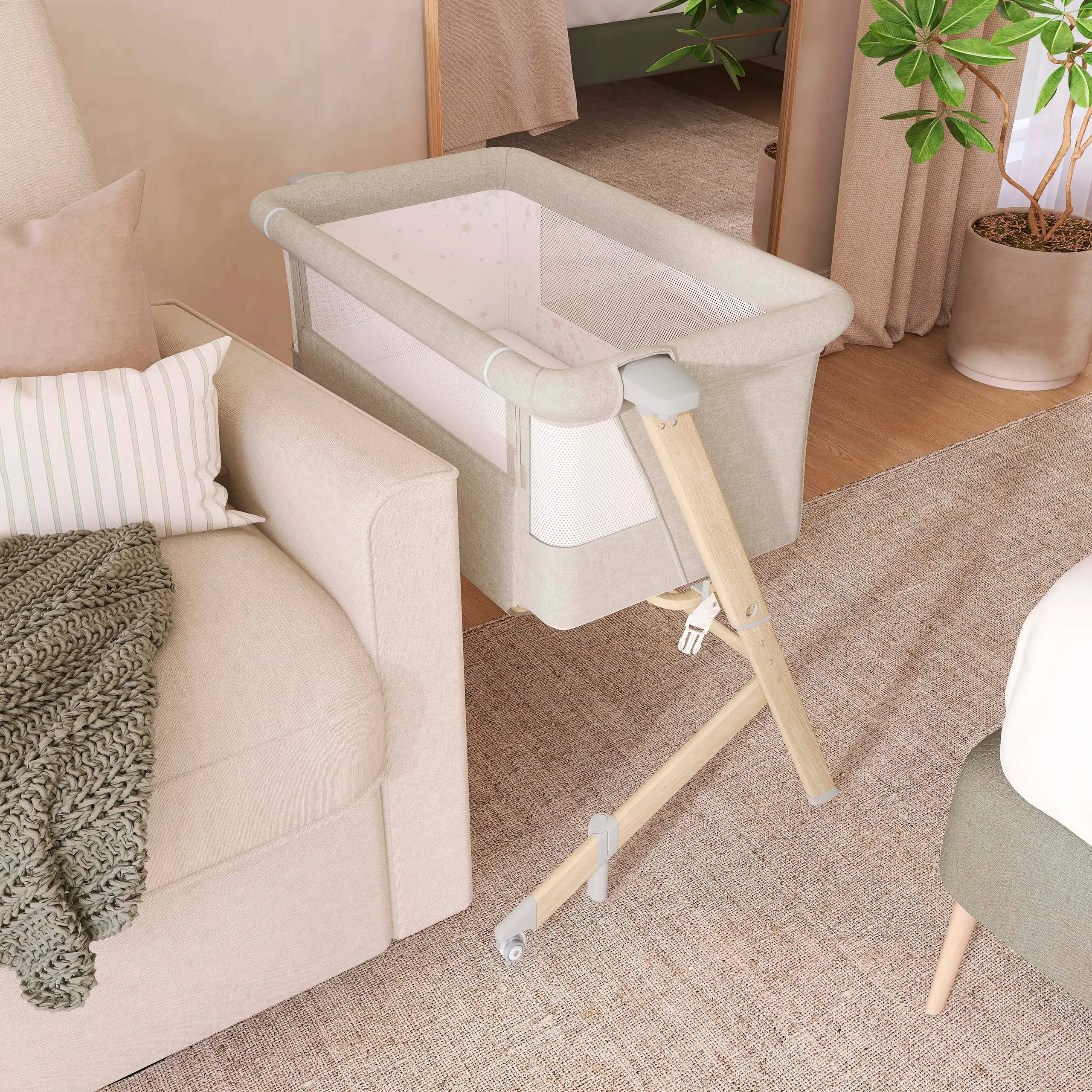 Dream On Me Skylar Bassinet And Bedside Sleeper Placed in a neutral aesthetic room with a plant