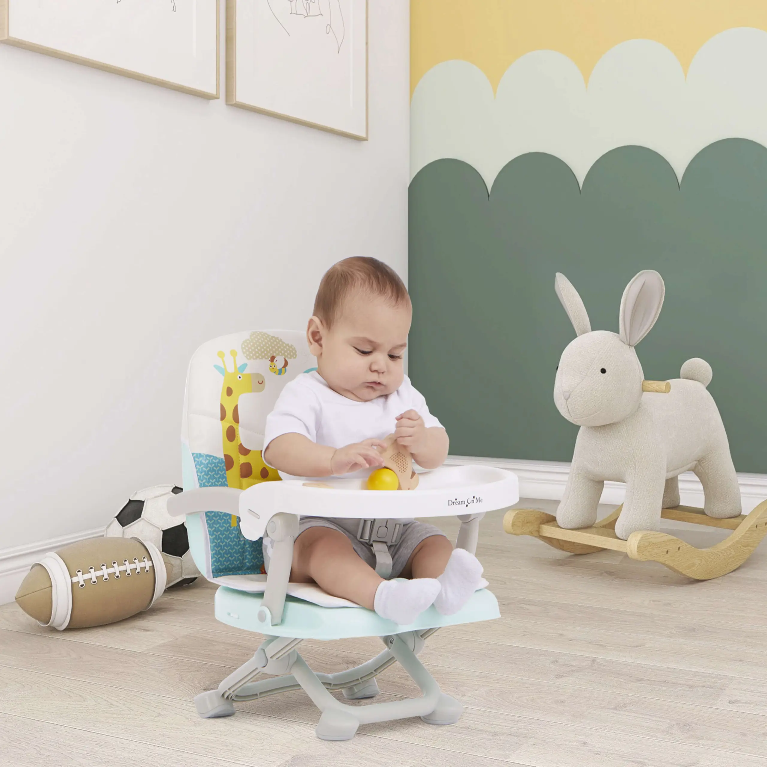 Baby seated in a high chair playing with a toy in a calm nursery