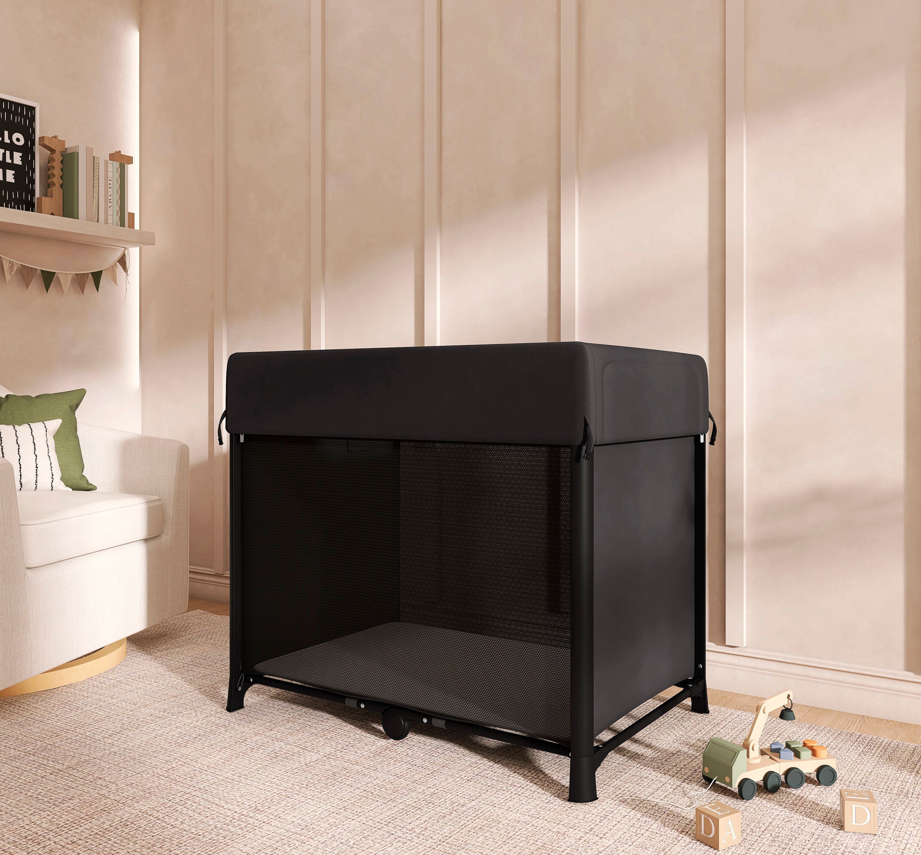 Evolur Zane Portable Playard placed in a softly lit nursery room with neutral decor and wooden toys on the carpet