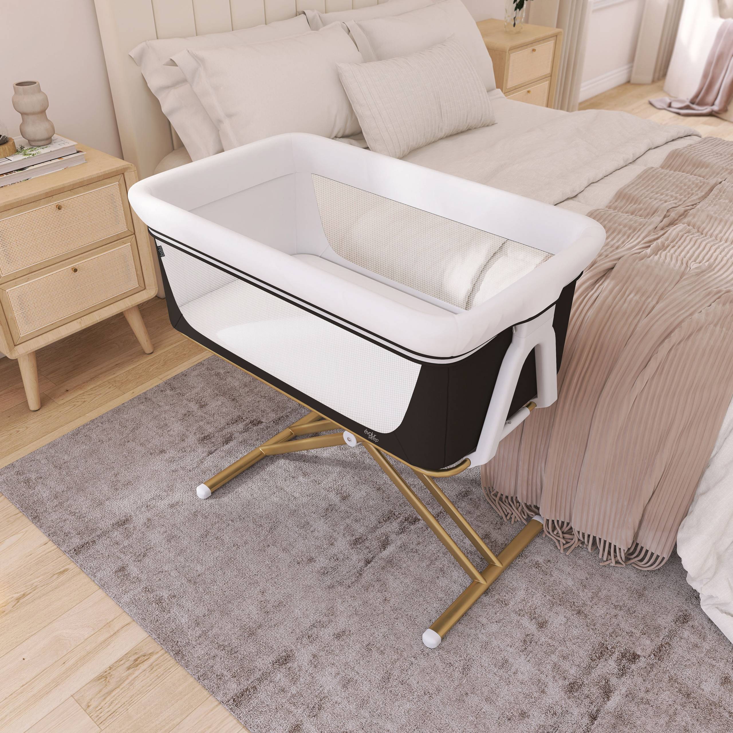 Evolur Orabelle bassinet in modern black and white color with mesh sides and gold frame, bedside sleeper crib for newborns