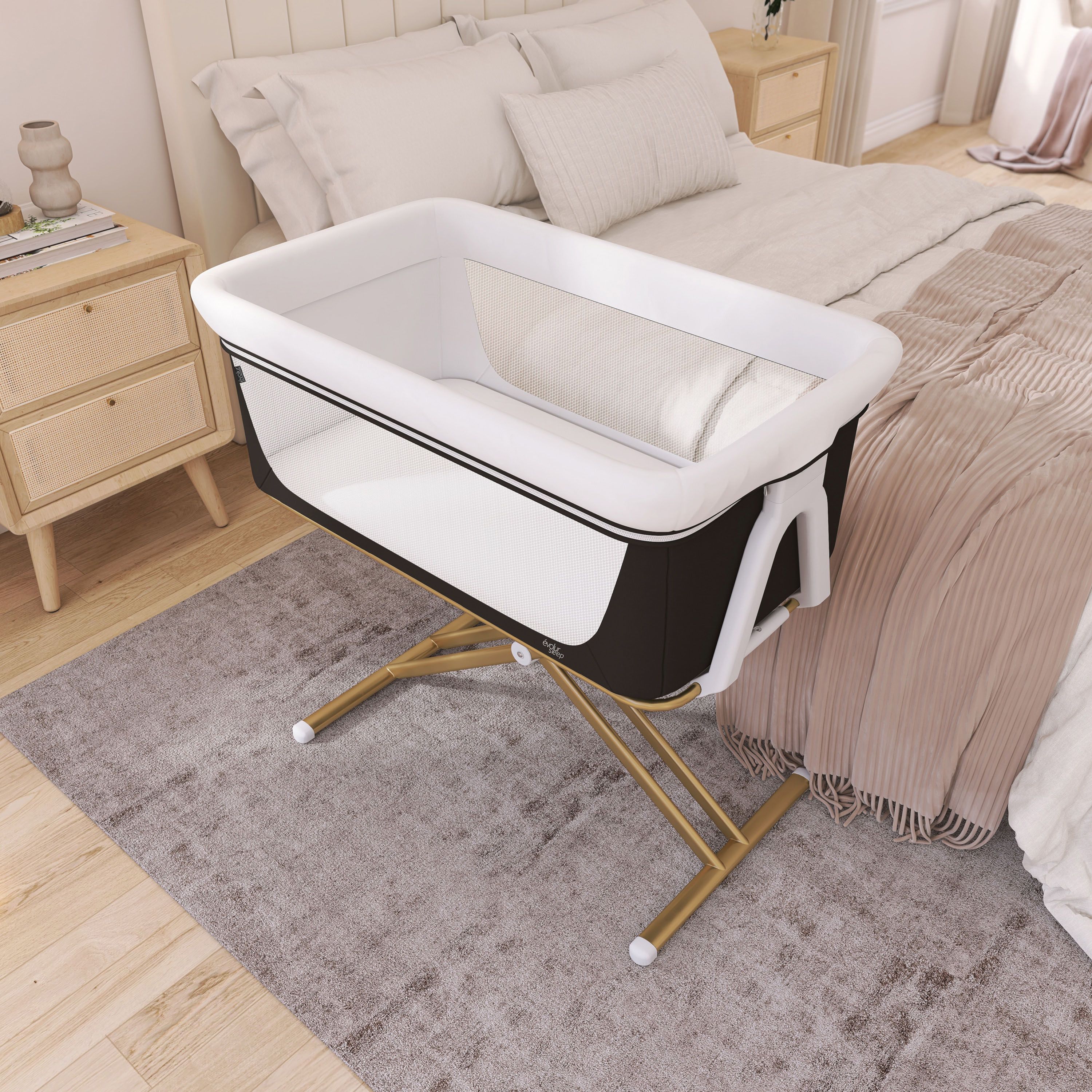 Evolur Orabelle bassinet in modern black and white color with mesh sides and gold frame, bedside sleeper crib for newborns