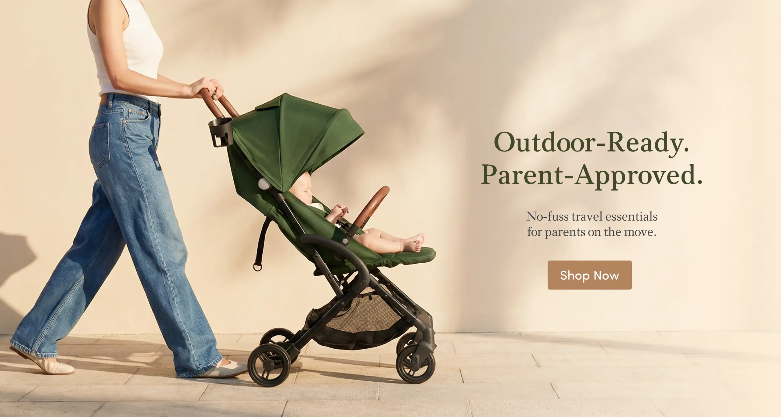 A woman pushes a green baby stroller with a baby inside. Text: Outdoor-Ready. Parent-Approved.