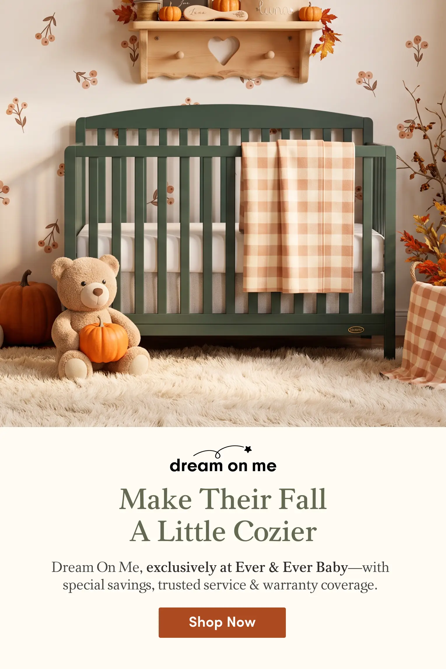 A warm, fall-themed baby nursery featuring a green crib, a plush teddy bear holding a pumpkin, a plaid blanket, and a fluffy rug.