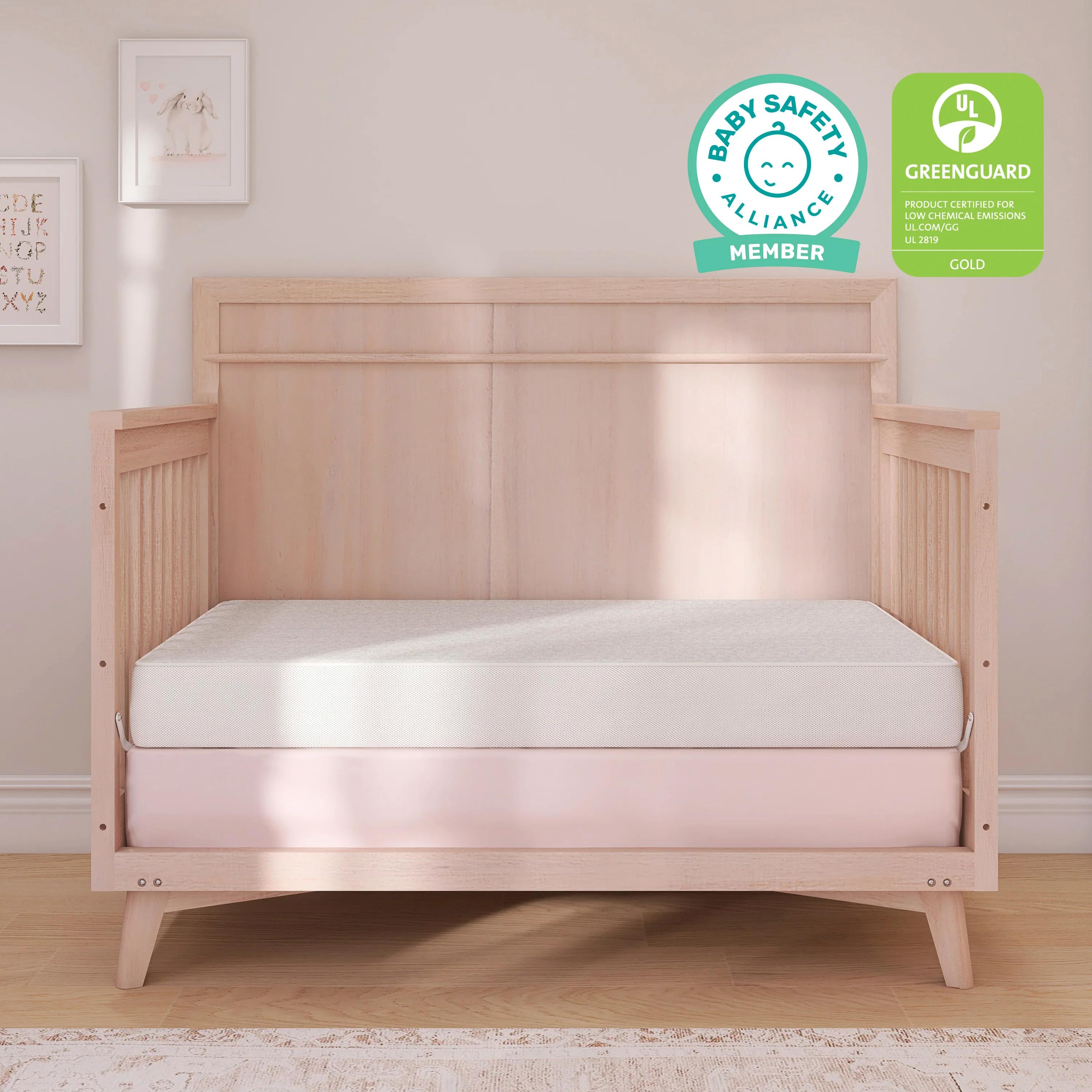 Evolur Sleep Breathable Dual Stage Comfort-Lite 5-inch foam crib mattress placed in a wooden crib