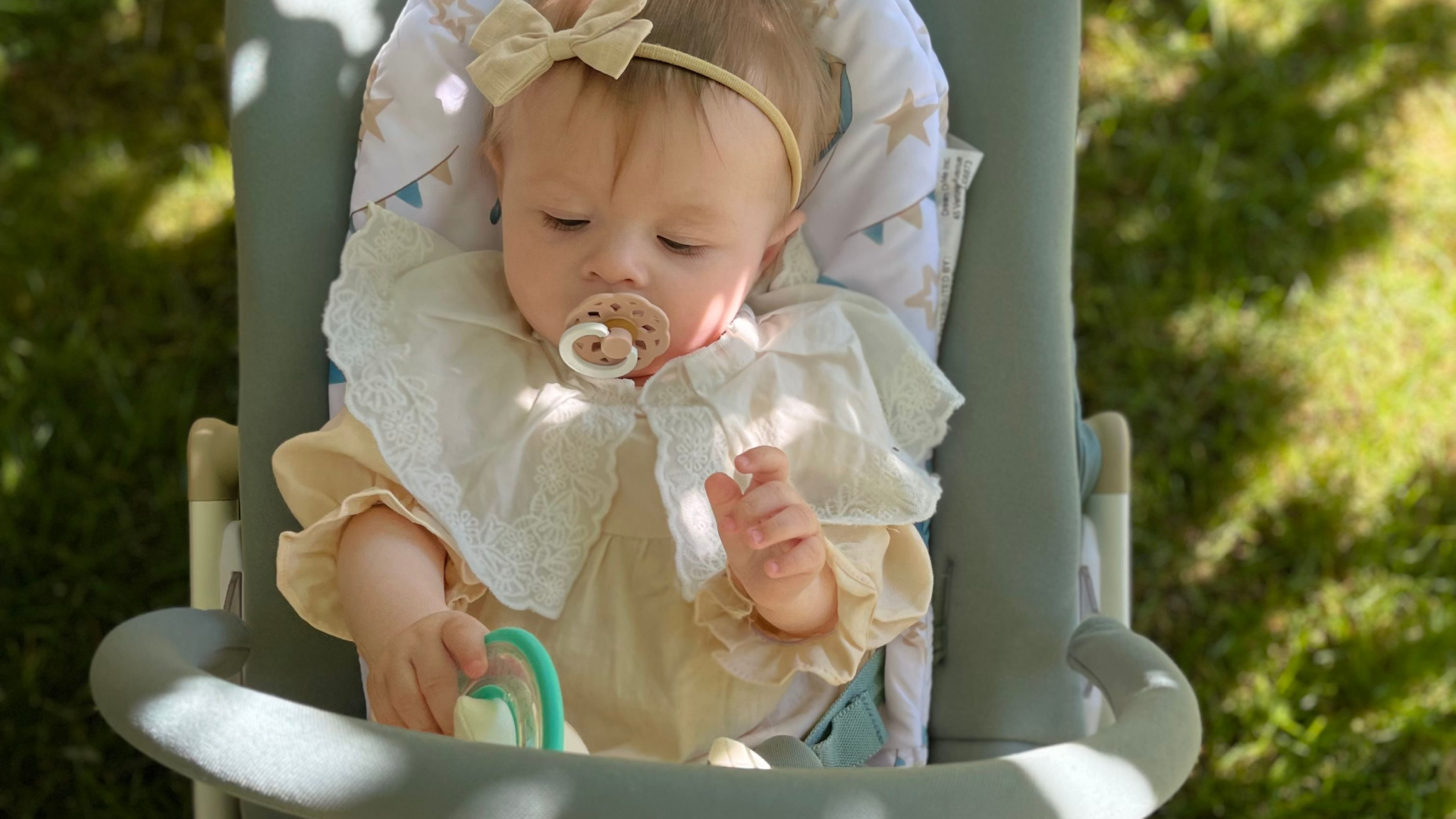 Evolur SleekSway baby rocker in use with infant, showing gentle rocking design