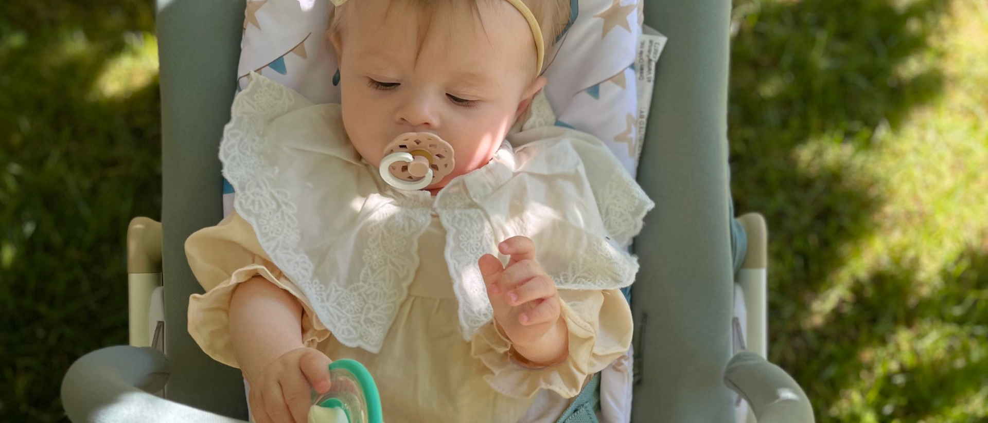 Evolur SleekSway baby rocker in use with infant, showing gentle rocking design