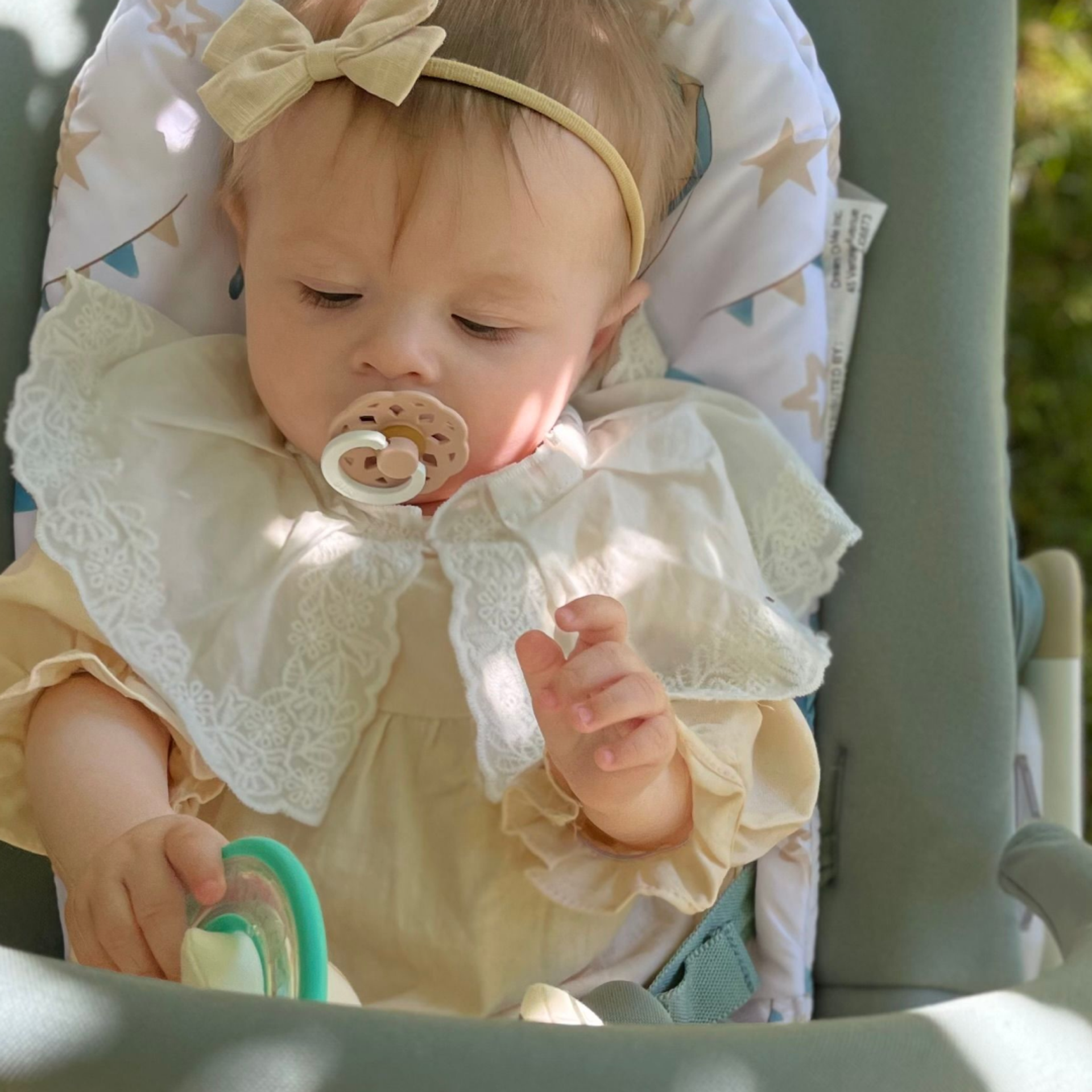 Evolur SleekSway baby rocker in use with infant, showing gentle rocking design