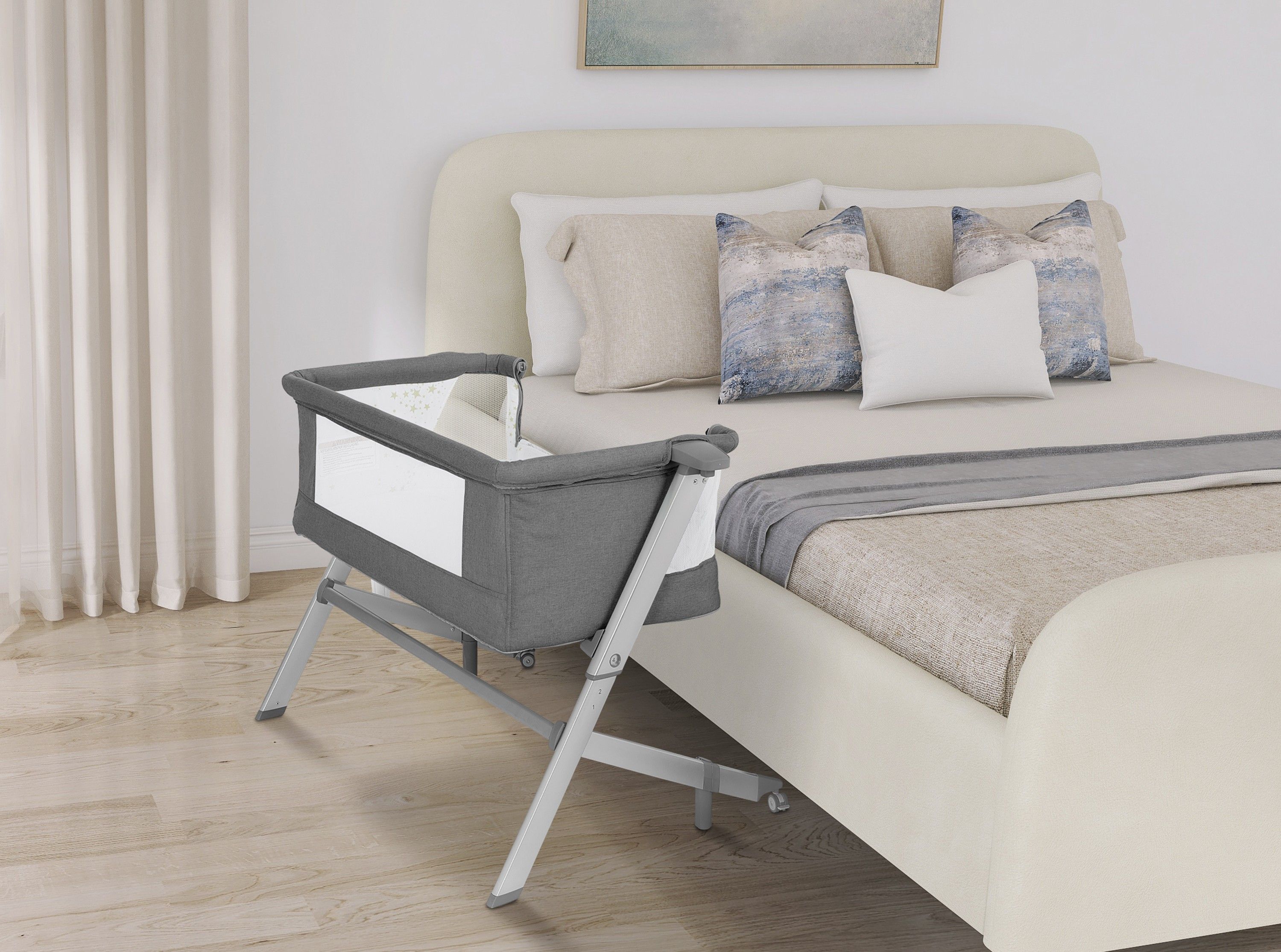 Dream On Me gray Skylar bassinet with mesh sides and adjustable frame, designed for bedside use and safe newborn sleep