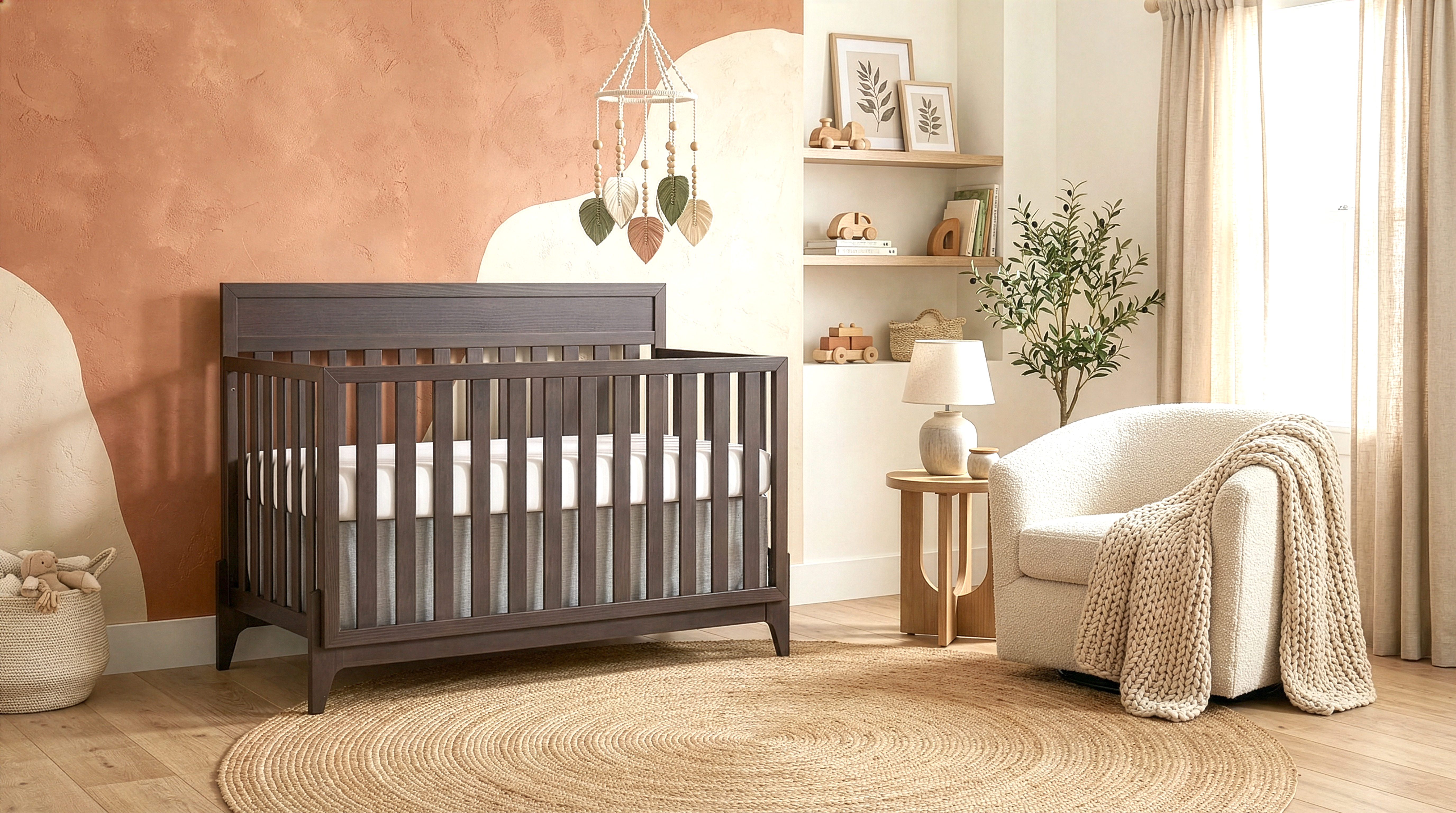 Modern baby nursery featuring Evolur Atlas 5-in-1 Convertible crib for multi-stage longevity, a textured rug, a cozy chair, and minimalist wall décor