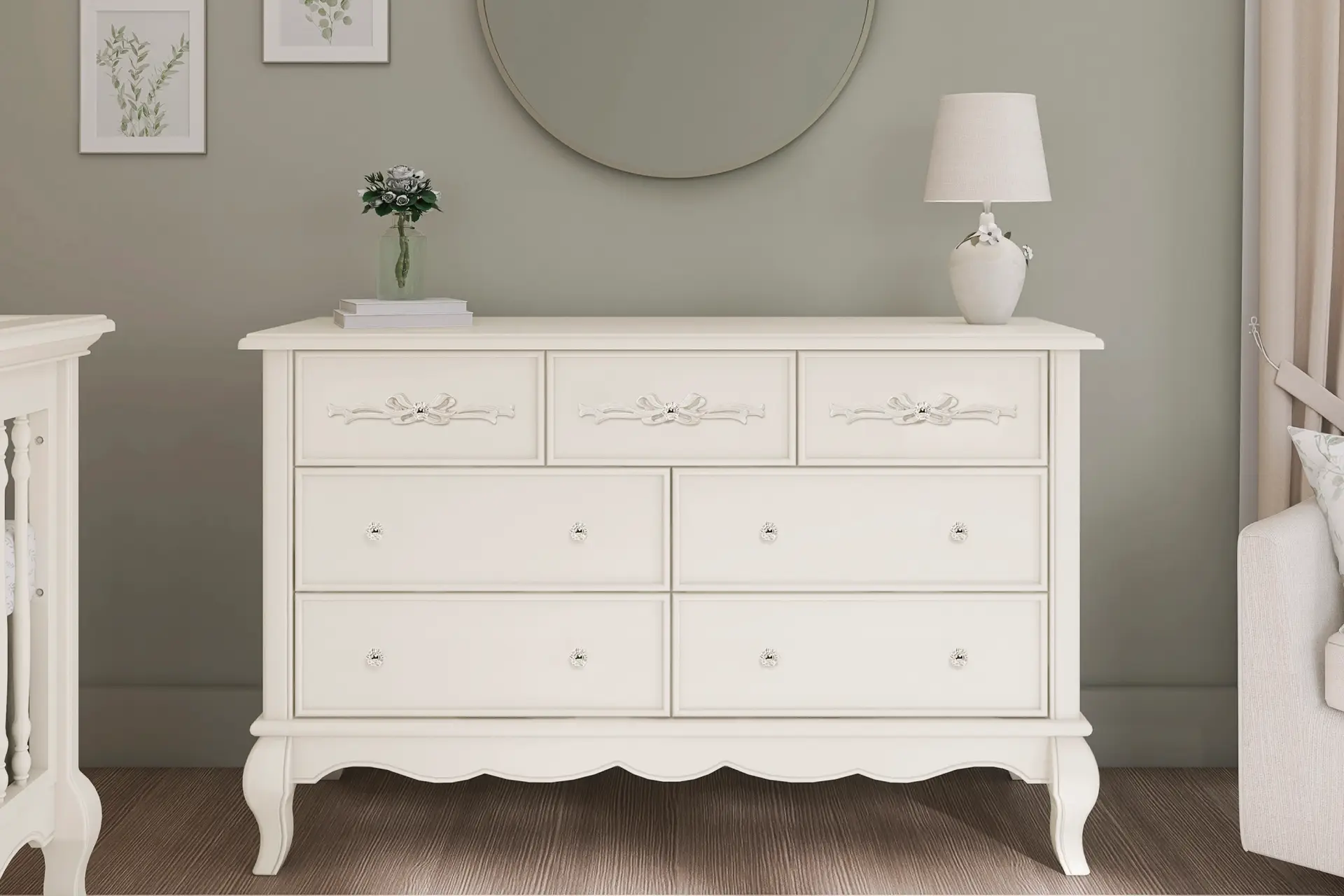 Evolur Aurora Double dresser with ornate detailing and crystal knobs, styled with a round wall mirror, table lamp, and botanical artwork, placed in a softly lit, neutral-toned room.