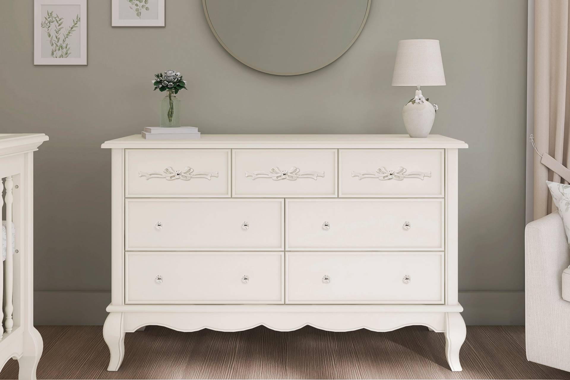 Evolur Aurora Double dresser with ornate detailing and crystal knobs, styled with a round wall mirror, table lamp, and botanical artwork, placed in a softly lit, neutral-toned room.