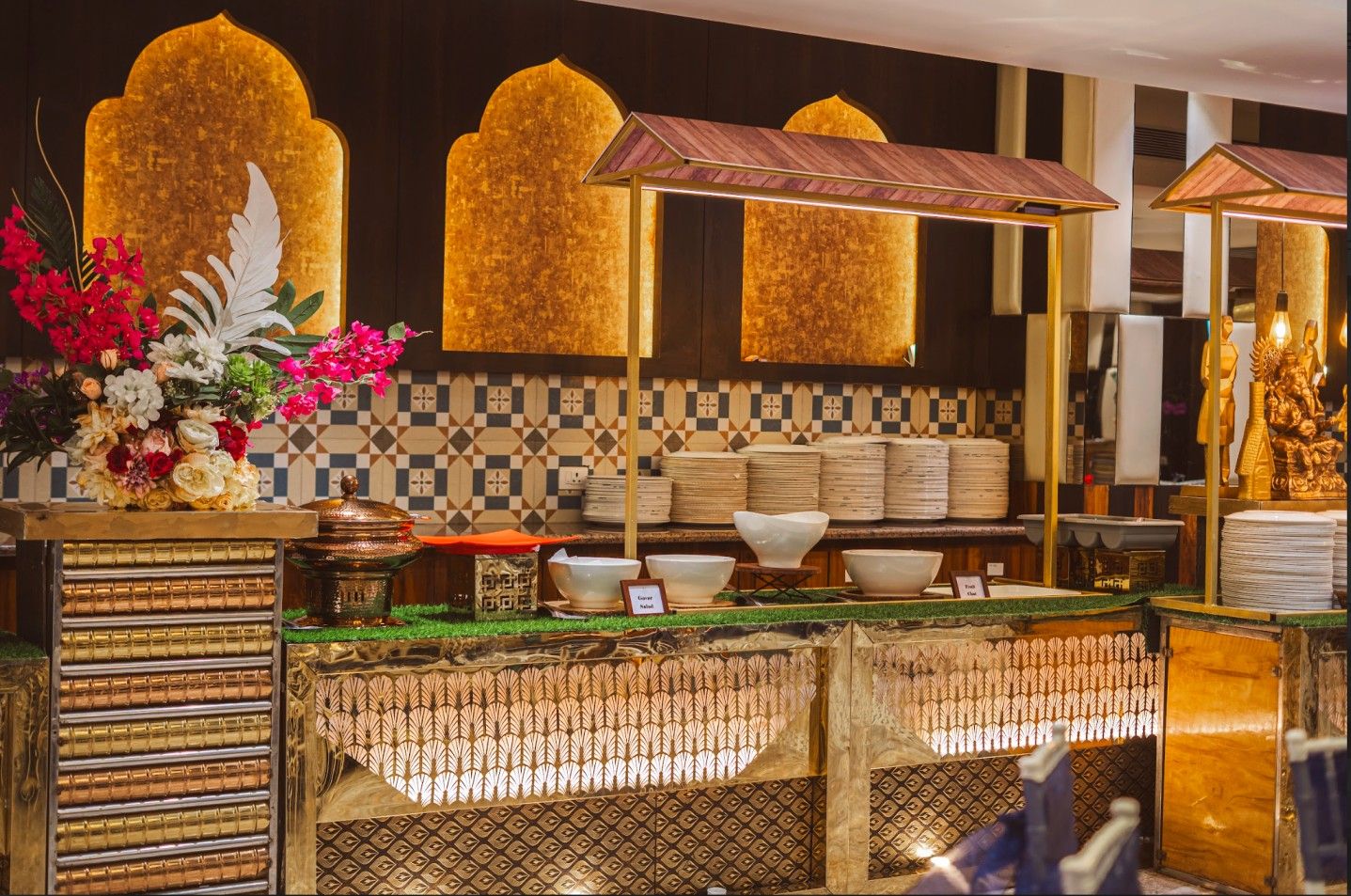 Lavish vegetarian buffet setup by Bendre Caterers near Pune showcasing elegant décor and live food counters at Avismara Celebrations.