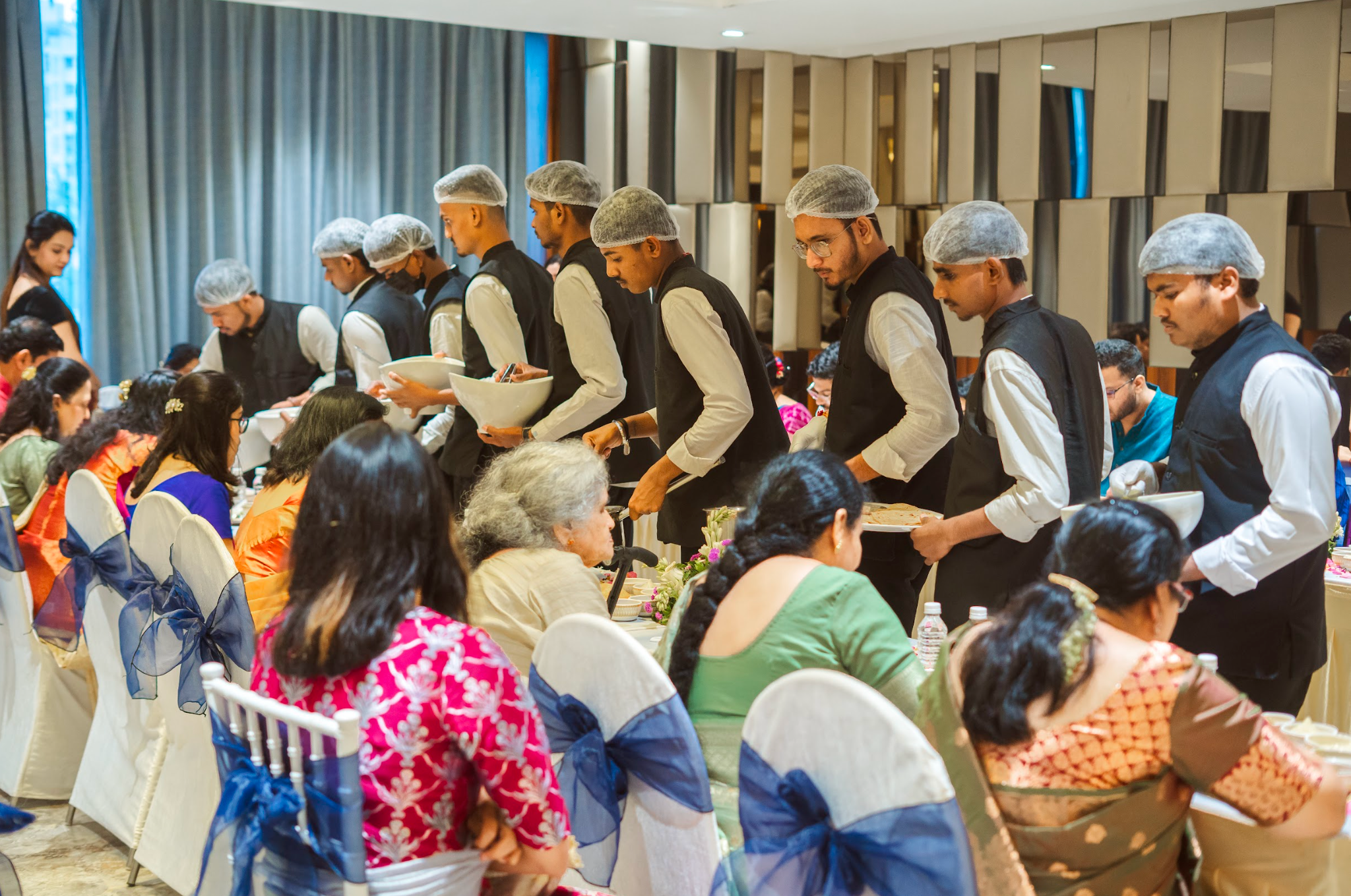 Bride and groom at a beautifully catered wedding at Avismara Celebrations in Pune, showcasing plated setup, décor, and banquet ambiance.