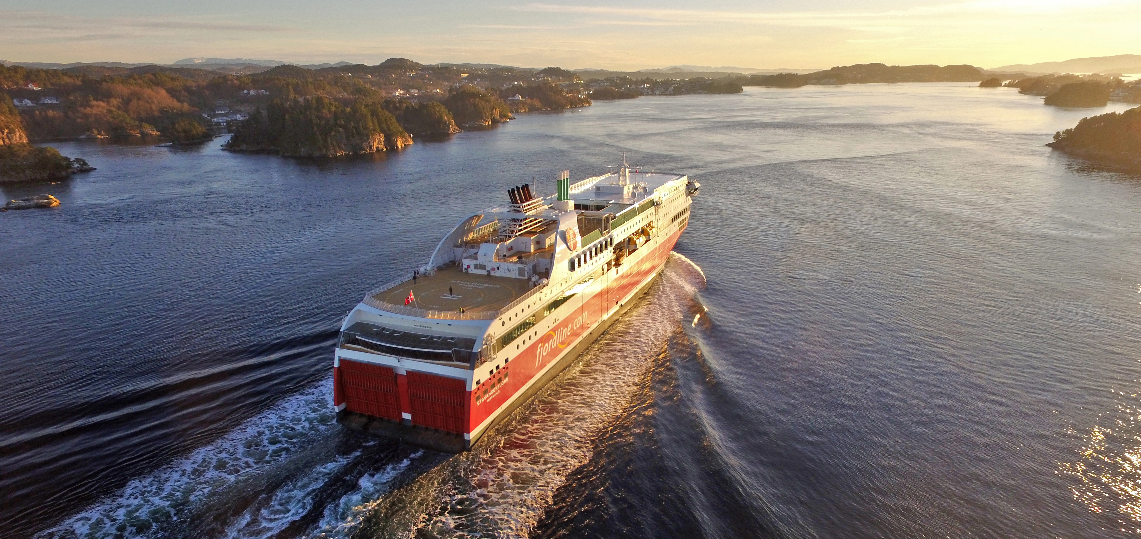 an aerial view of a large cruise ship floating on top of a large body of water .