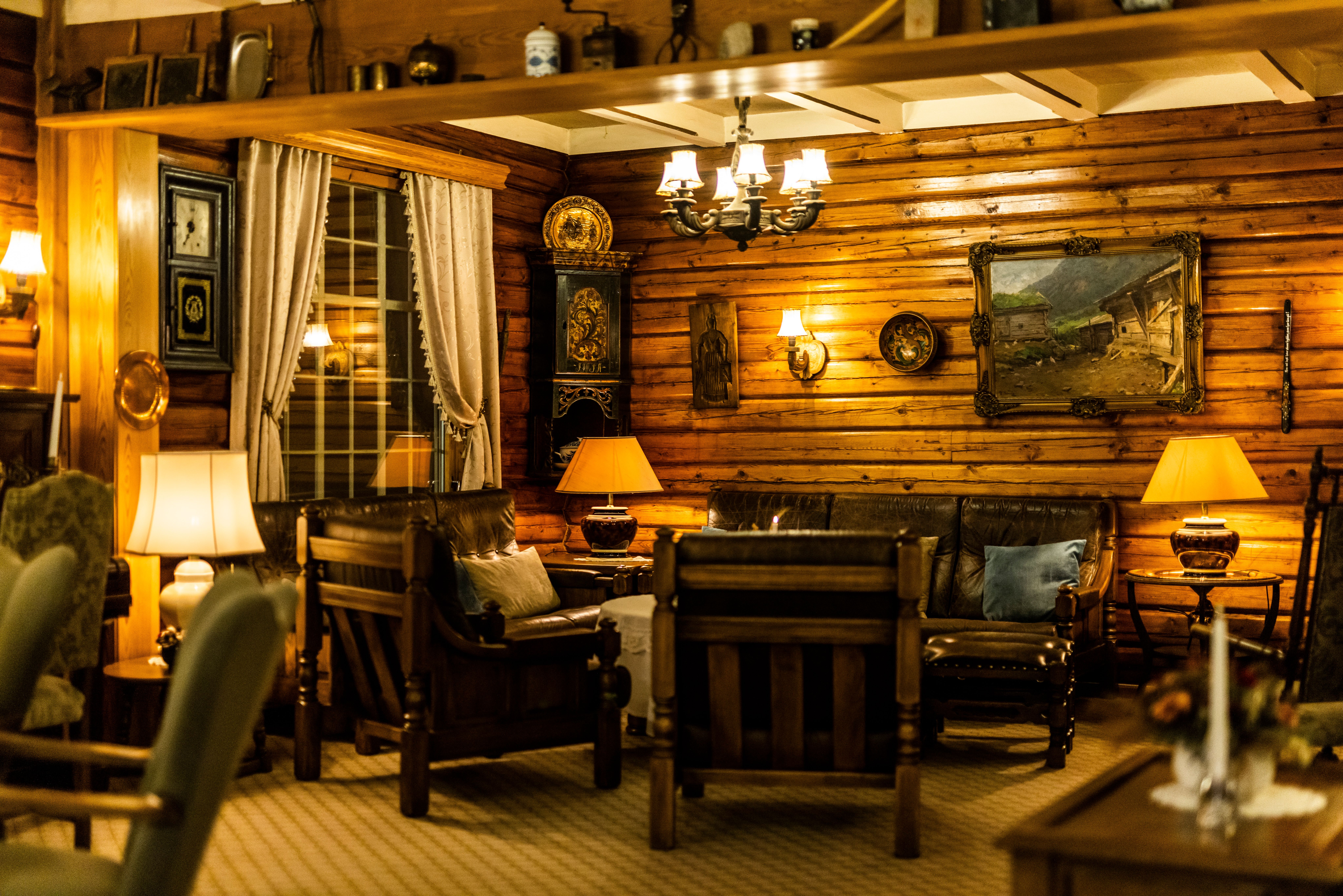 a living room filled with furniture and a clock on the wall .