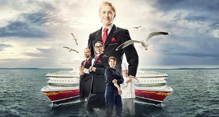 a group of people standing in front of a cruise ship in the ocean .