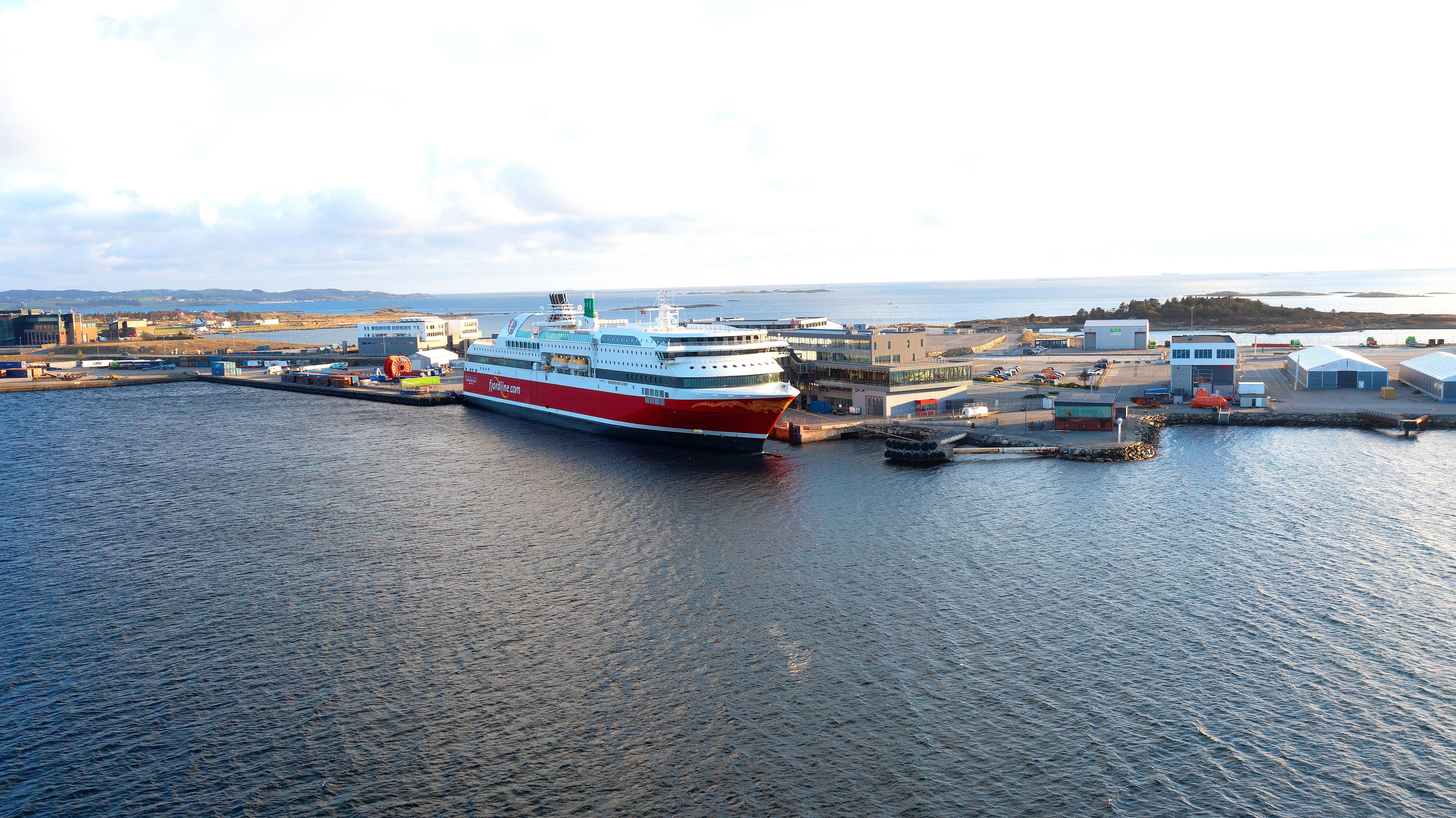an aerial view of a cruise ship docked in a harbor .