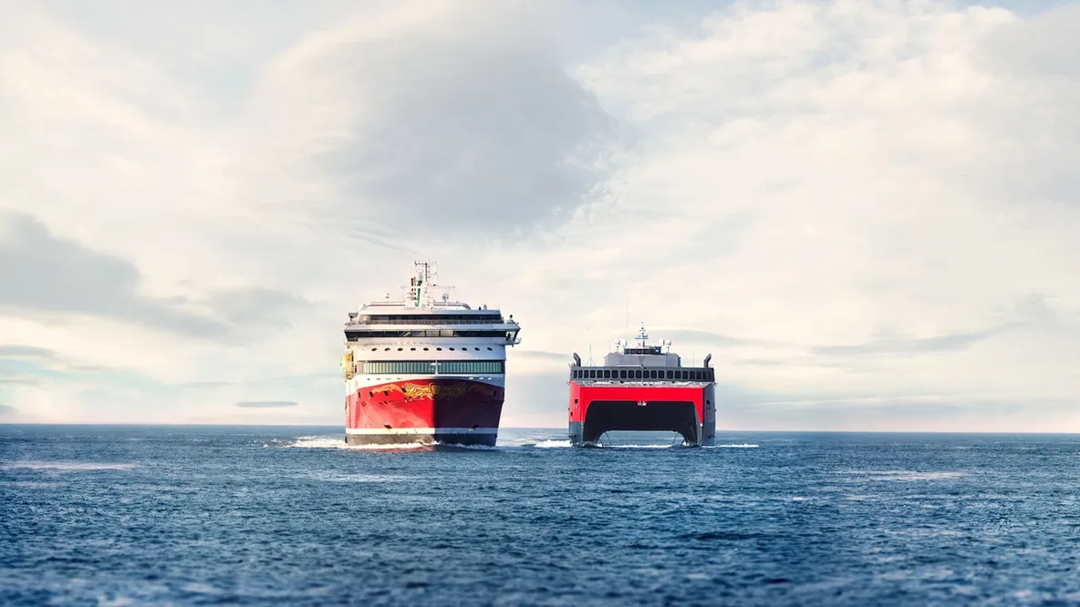 two cruise ships are floating on top of a large body of water .