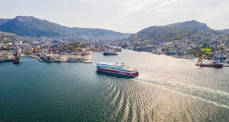 an aerial view of a large cruise ship floating on top of a body of water .