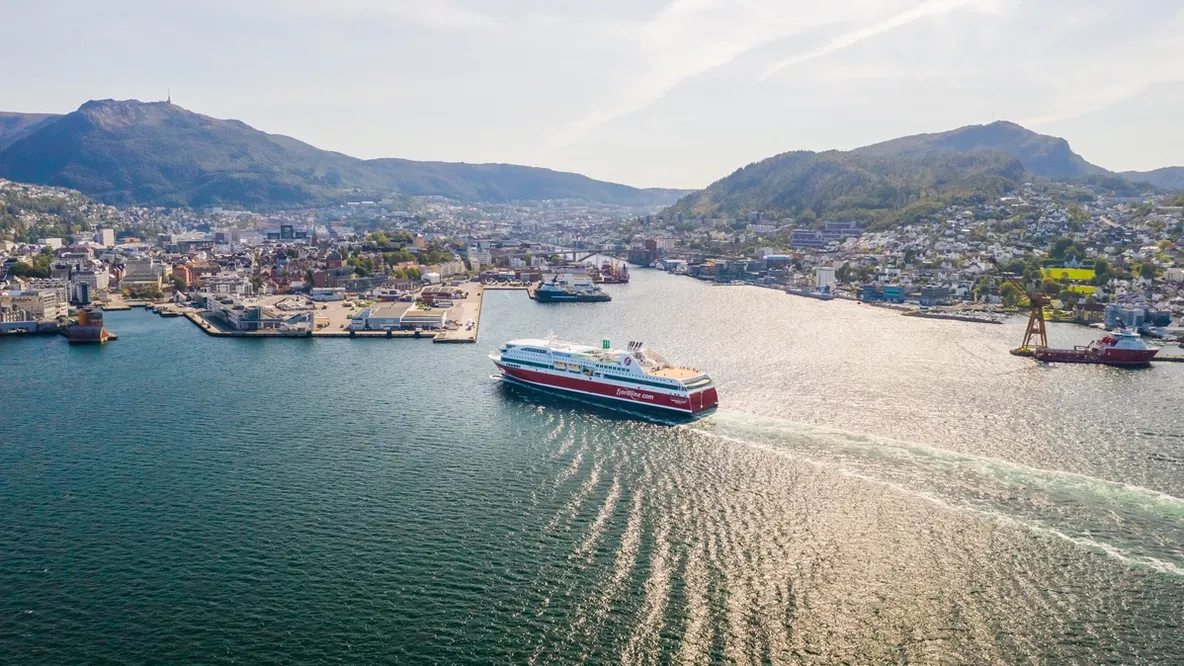 an aerial view of a large cruise ship floating on top of a body of water .