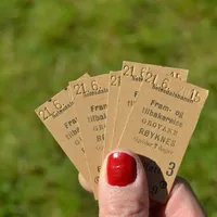 Hand holding old train tickets