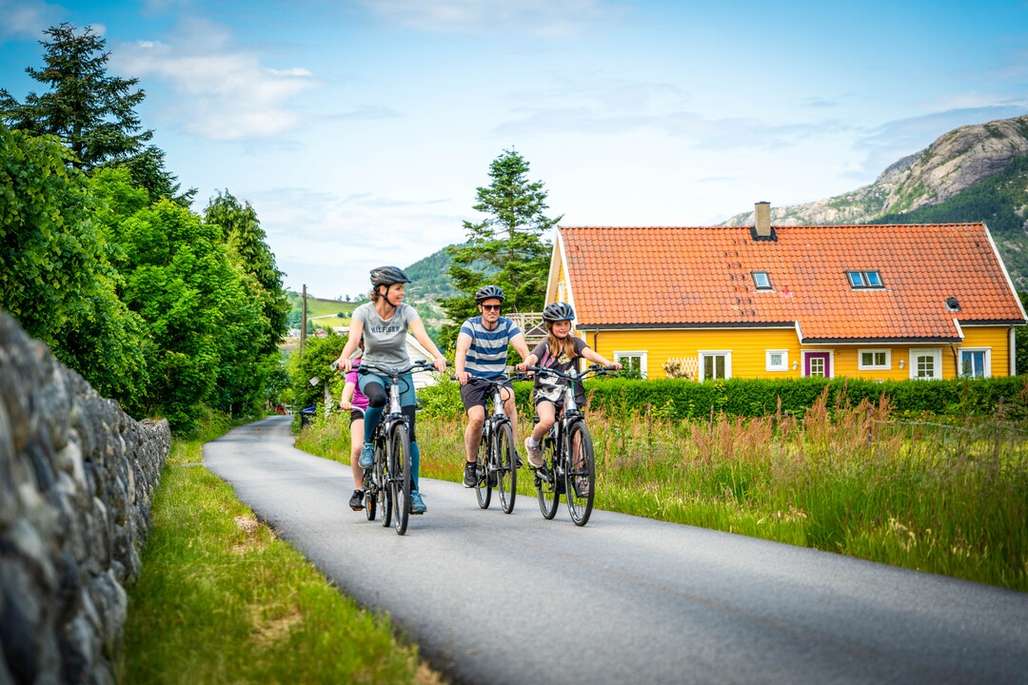 Family on a bike ride in a rural setting.